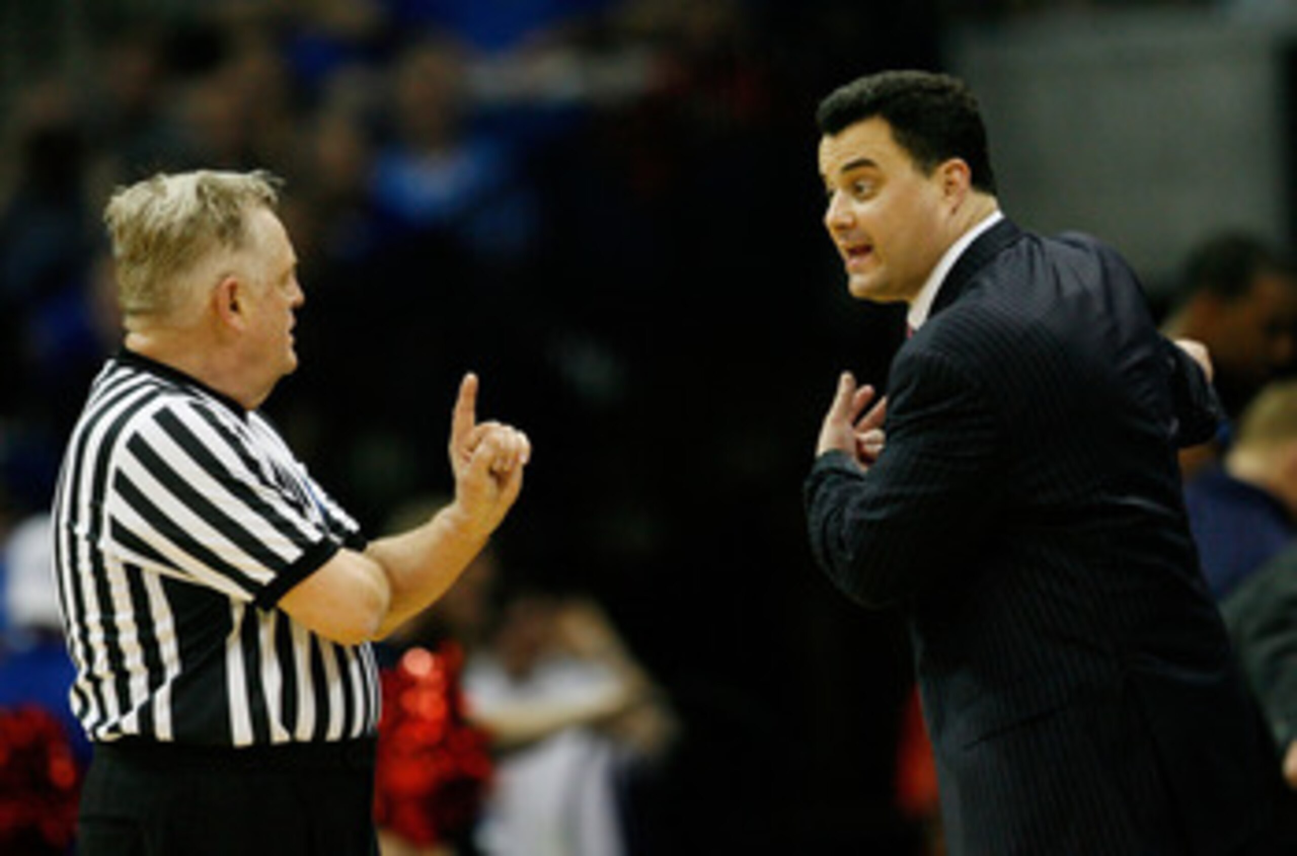 TULSA, OK - MARCH 20:  Head coach Sean Miller of the Arizona Wildcats argues with referee Jim Burr during the third round against the Texas Longhorns in the 2011 NCAA men's basketball tournament at BOK Center on March 20, 2011 in Tulsa, Oklahoma.  (Photo 