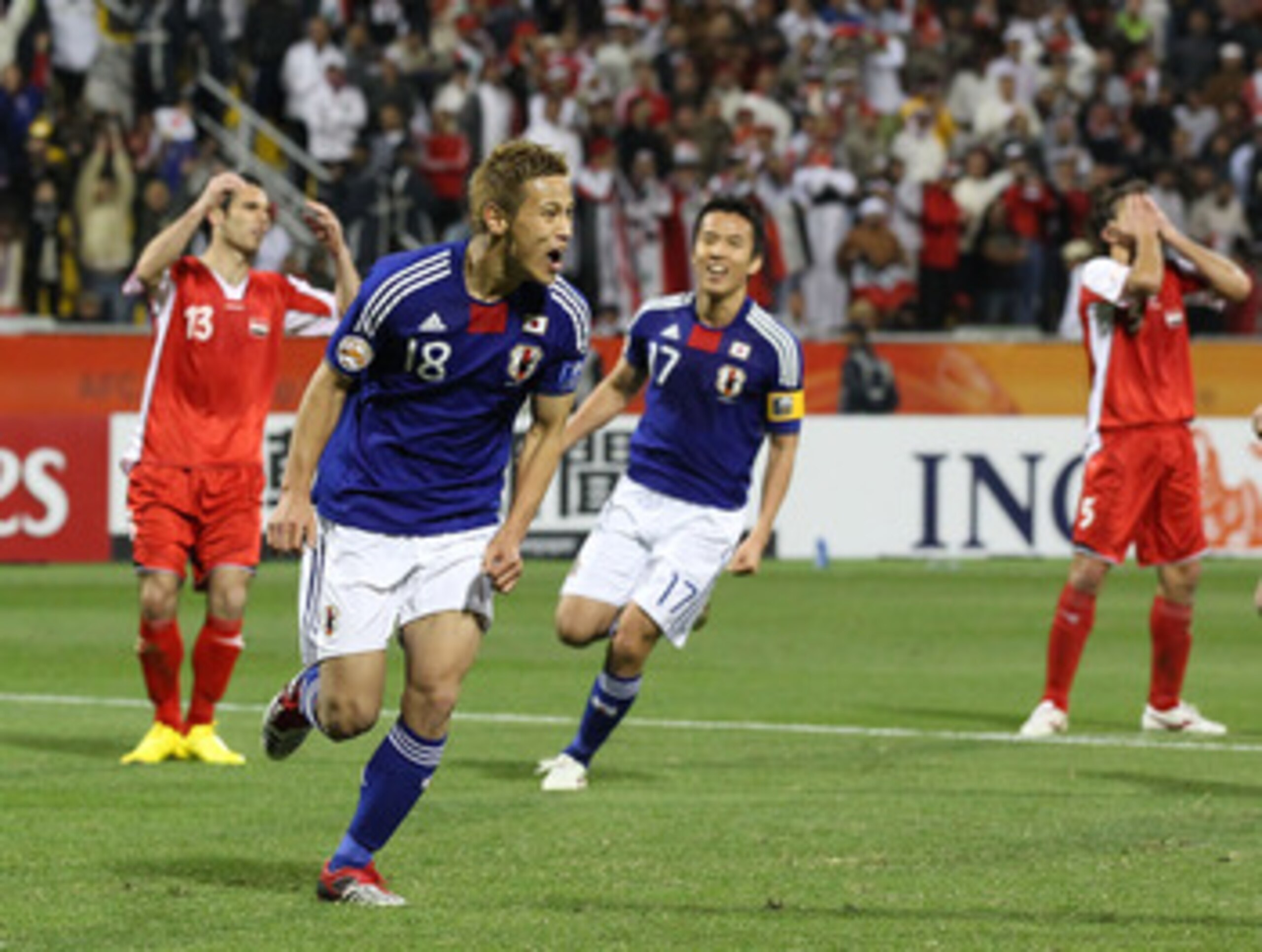 DOHA, QATAR - JANUARY 13:  Keisuke Honda of Japan celebrates scoring his penalty during the AFC Asian Cup Group B match between Syria and Japan at Qatar Sports Club Stadium on January 13, 2011 in Doha, Qatar.  (Photo by Robert Cianflone/Getty Images)