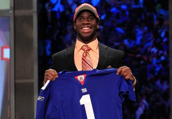 NEW YORK, NY - APRIL 28:  Prince Amukamara, #19 overall pick by the New York Giants, holds up a jersey on stage during the 2011 NFL Draft at Radio City Music Hall on April 28, 2011 in New York City.  (Photo by Chris Trotman/Getty Images)