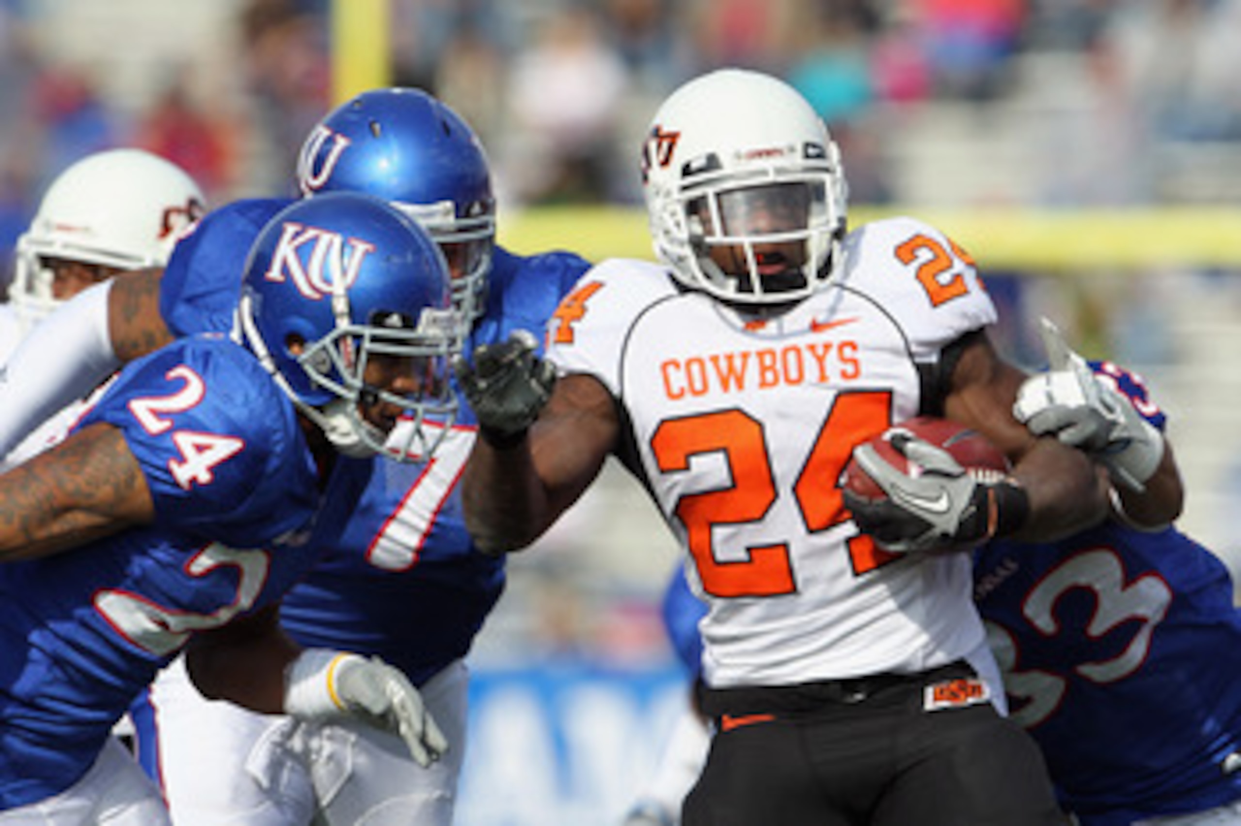 LAWRENCE, KS - NOVEMBER 20: Running back Kendall Hunter #24 of the Oklahoma State Cowboys carries the ball during the game against the Kansas Jayhawks on November 20, 2010 at Memorial Stadium in Lawrence, Kansas. (Photo by Jamie Squire/Getty Images) LAWRENCE, KS - NOVEMBER 20: Running back Kendall Hunter #24 of the Oklahoma State Cowboys carries the ball during the game against the Kansas Jayhawks on November 20, 2010 at Memorial Stadium in Lawrence, Kansas. (Photo by Jamie Squire/Getty Images)