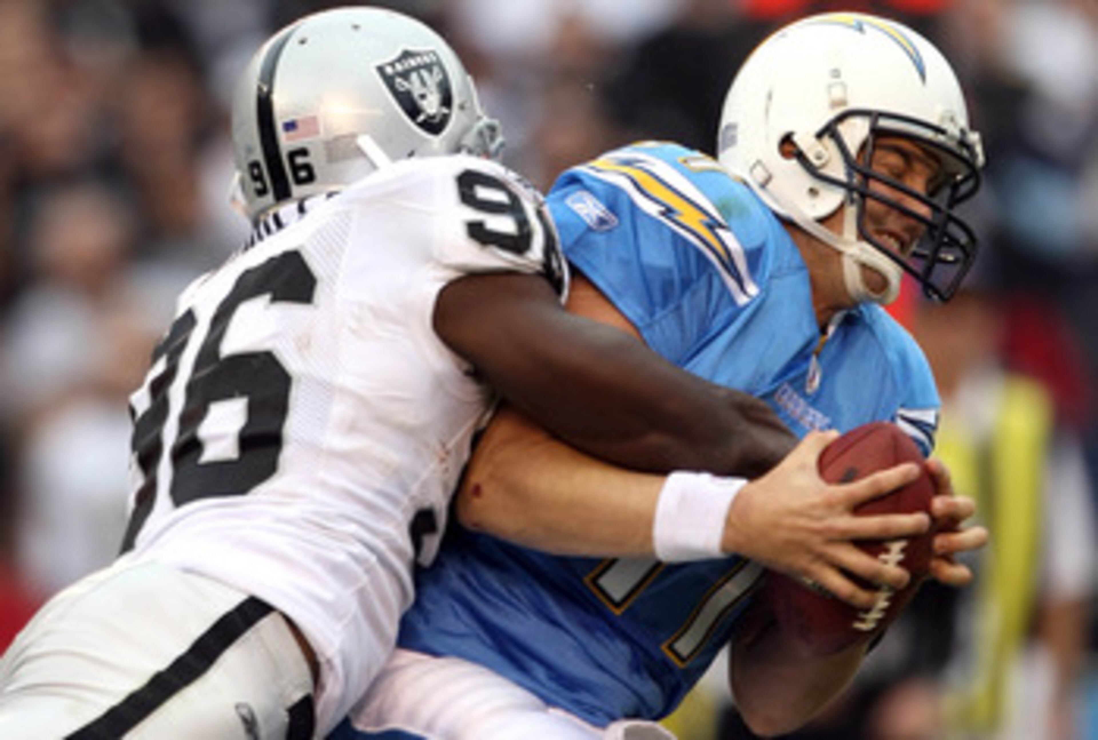 SAN DIEGO, CA - DECEMBER 5: Quarterback Philip Rivers #17 of the San Diego Chargers is sacked by Kamerion Wimbley #96 of the Oakland Raiders during their NFL game at Qualcomm Stadium on December 5, 2010 in San Diego, California. (Photo by Donald Miralle/ SAN DIEGO, CA - DECEMBER 5: Quarterback Philip Rivers #17 of the San Diego Chargers is sacked by Kamerion Wimbley #96 of the Oakland Raiders during their NFL game at Qualcomm Stadium on December 5, 2010 in San Diego, California. (Photo by Donald Miralle/