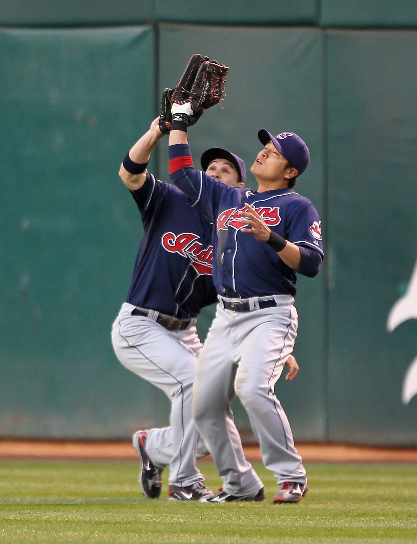 OAKLAND, CA - MAY 03:  Grady Sizemore #24 backs up Shin-Soo Choo #17 of the Cleveland Indians while Choo makes a catch on a ball hit by Mark Ellis #14 of the Oakland Athletics Oakland-Alameda County Coliseum on May 3, 2011 in Oakland, California.  (Photo