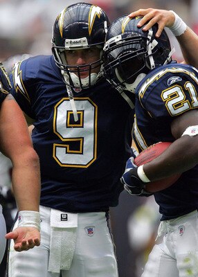 HOUSTON - SEPTEMBER 12:  Running back LaDainian Tomlinson #21of the San Diego Chargers celebrates a touchdown with quarterback Drew Brees #9 during play against the Houston Texans on September 12, 2004 at Reliant Stadium in Houston, Texas.  (Photo by Rona