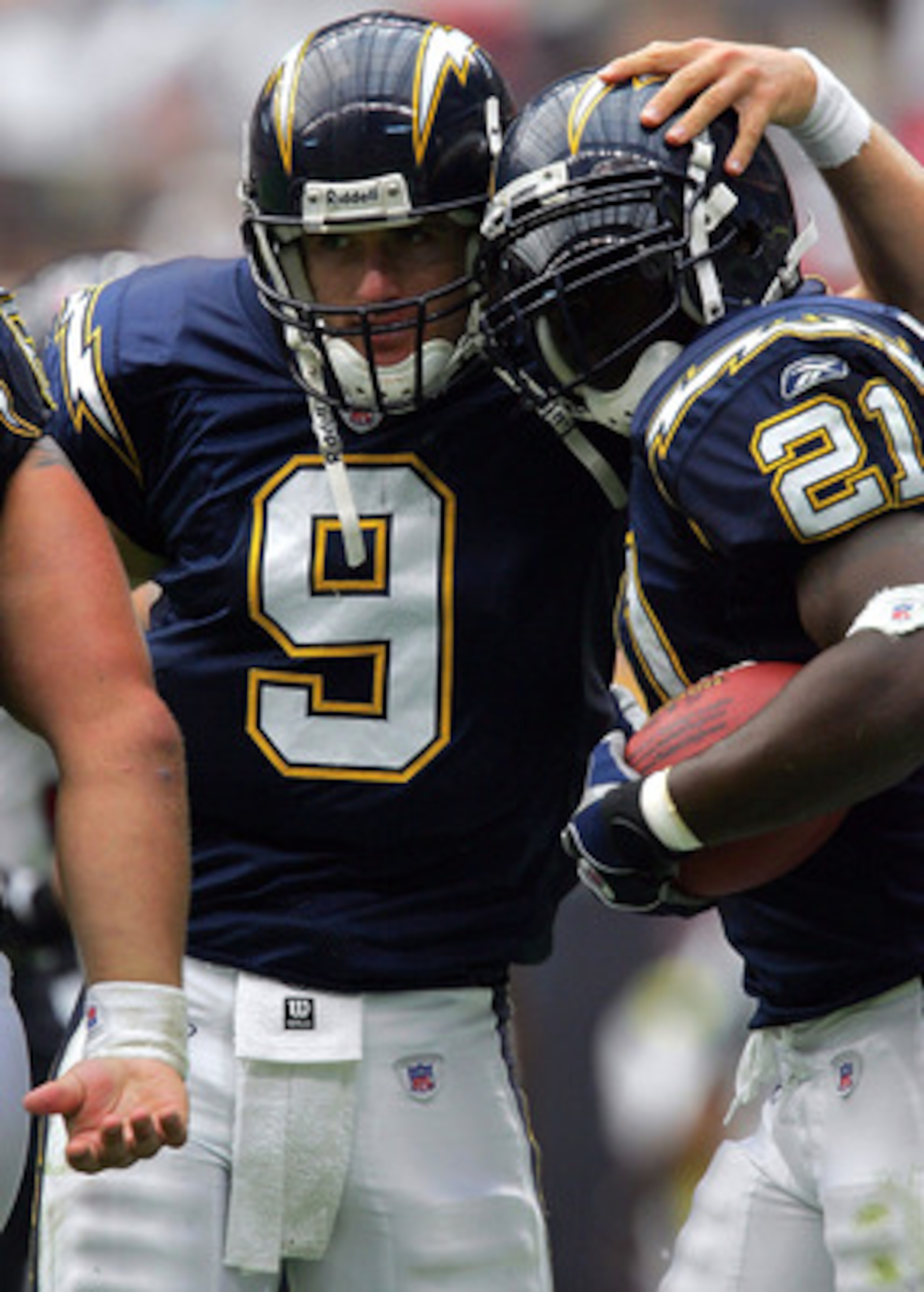 HOUSTON - SEPTEMBER 12:  Running back LaDainian Tomlinson #21of the San Diego Chargers celebrates a touchdown with quarterback Drew Brees #9 during play against the Houston Texans on September 12, 2004 at Reliant Stadium in Houston, Texas.  (Photo by Rona