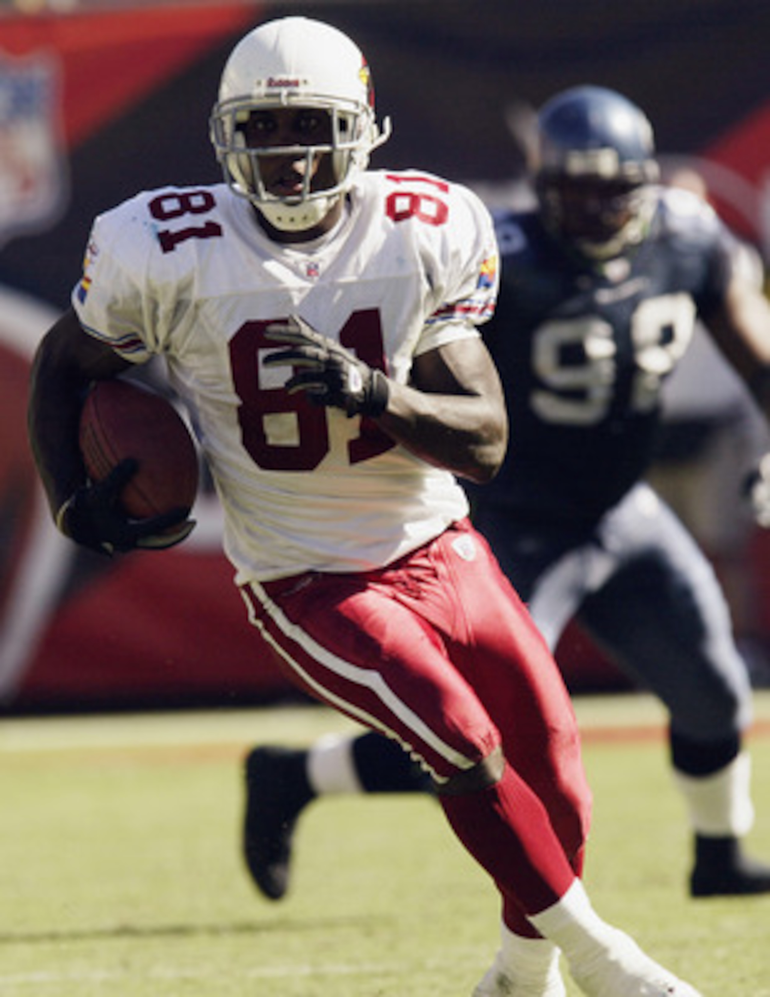 TEMPE, AZ - SEPTEMBER 14:   Wide receiver Anquan Boldin #81 of the Arizona Cardinals carries the ball against the Seattle Seahawks on September 14, 2003 at Sun Devil Stadium in Tempe, Arizona.  The Seahawks defeated the Cardinals 38-0.  (Photo by Stephen