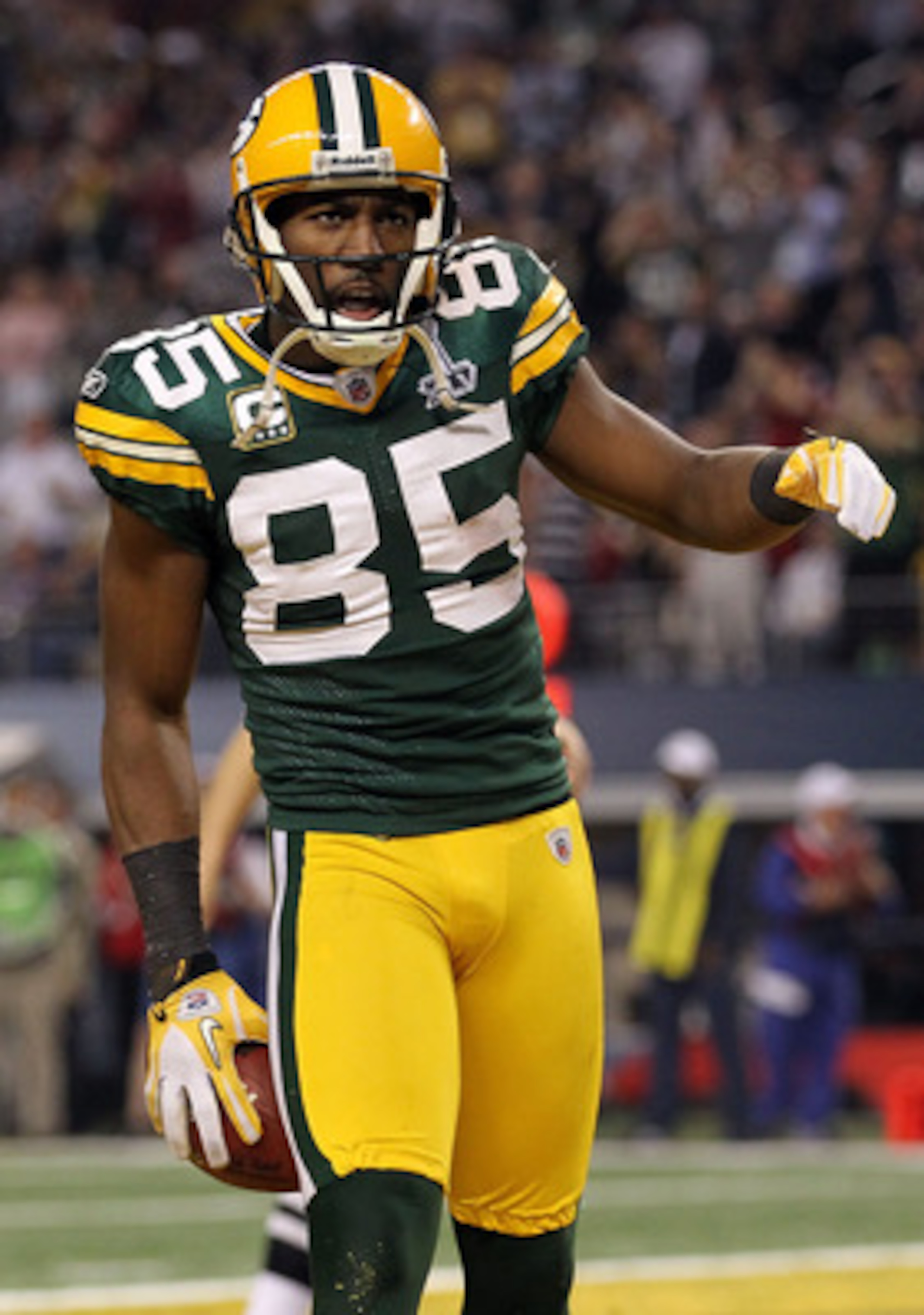 ARLINGTON, TX - FEBRUARY 06: Greg Jennings #85 of the Green Bay Packers celebrates after catching a 21 yard pass for a touchdown against the Pittsburgh Steelers during Super Bowl XLV at Cowboys Stadium on February 6, 2011 in Arlington, Texas.  (Photo by A