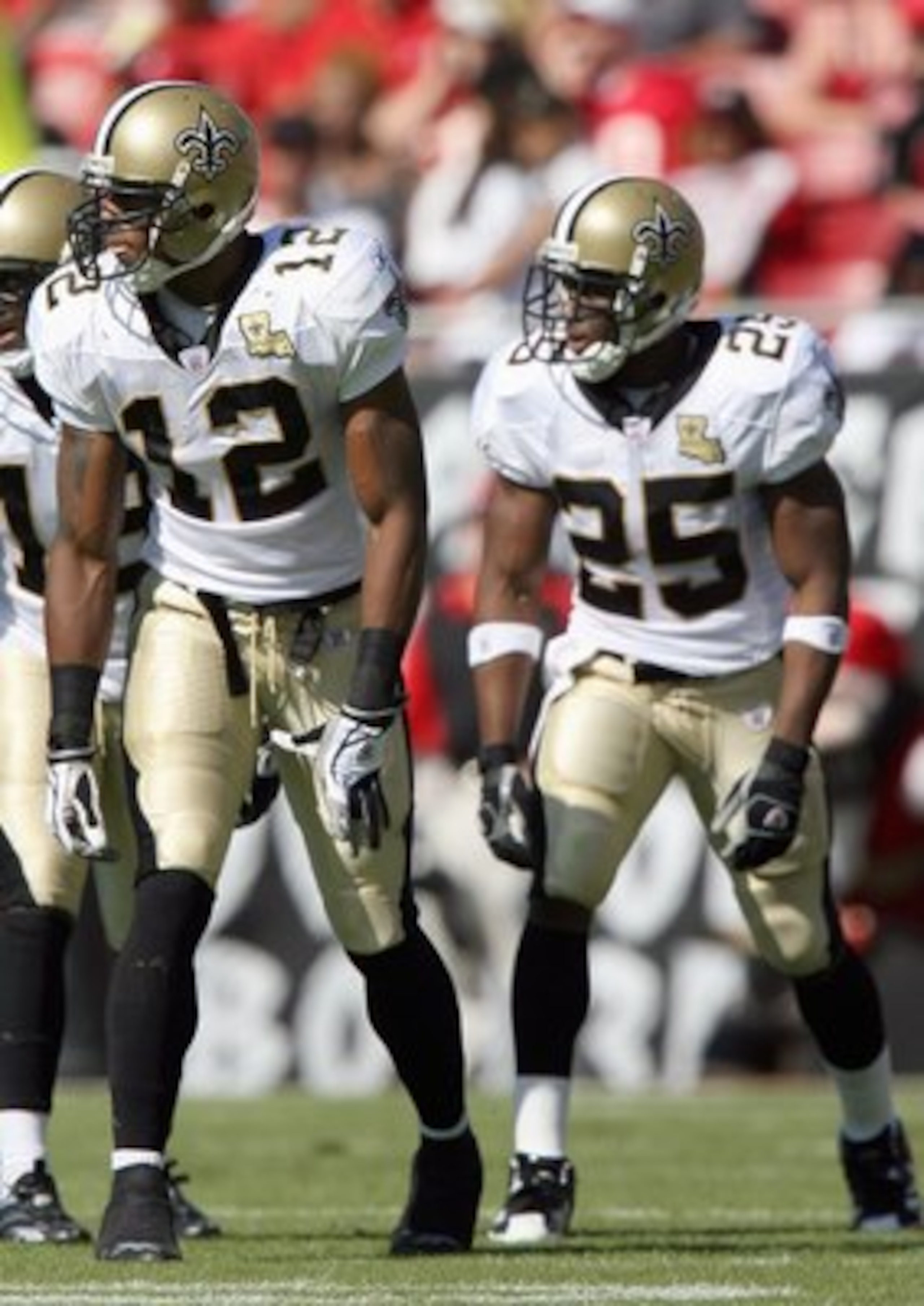 TAMPA, FL - NOVEMBER 5:  Marques Colston #12 Terrance Copper #18 Reggie Bush #25 of the New Orleans Saints gets ready to move at the snap during the game against the Tampa Bay Buccaneers on November 5, 2006 at Raymond James Stadium in Tampa, Florida. The
