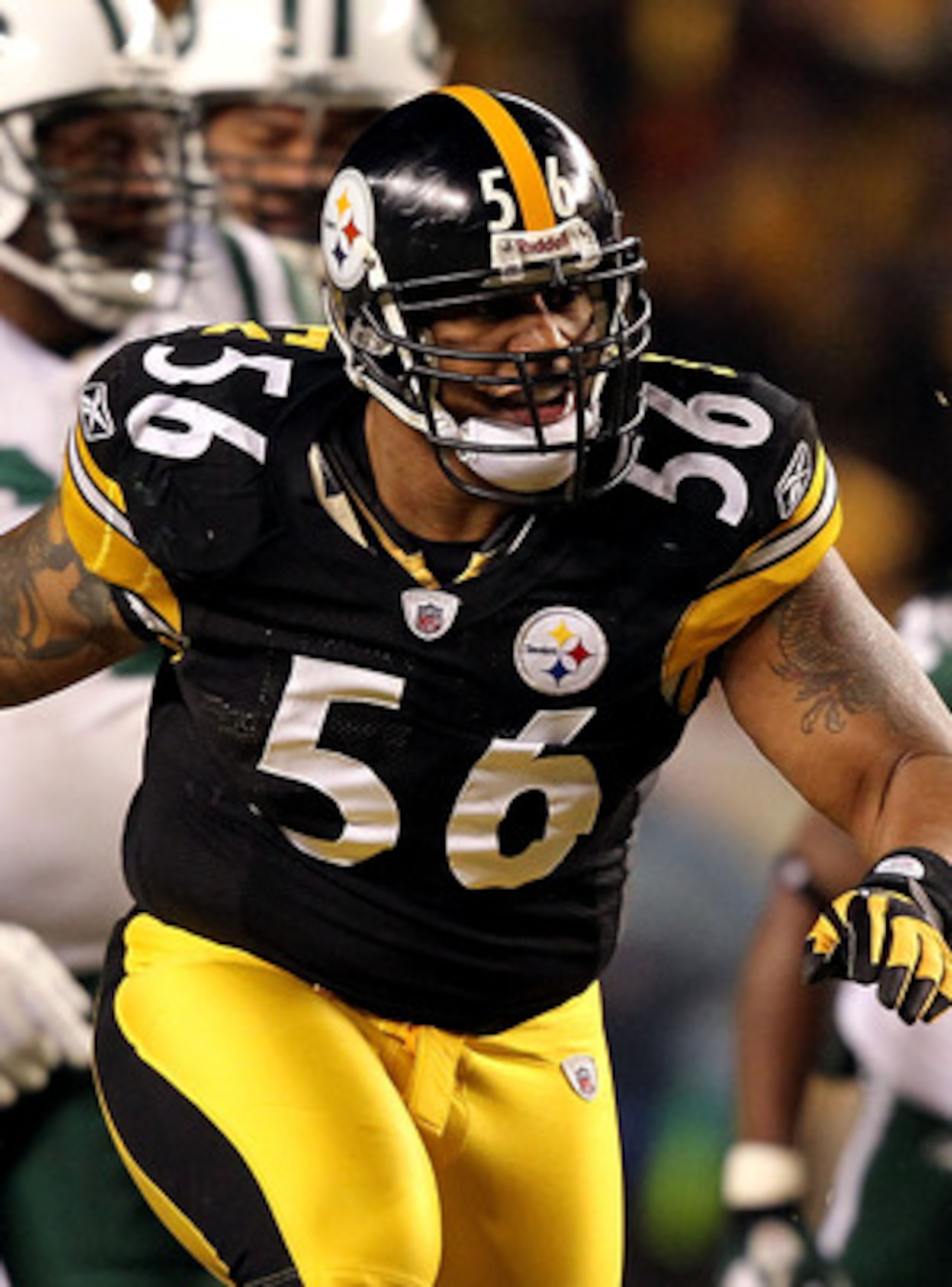 PITTSBURGH, PA - JANUARY 23:  LaMarr Woodley #56 of the Pittsburgh Steelers reacts after a sack against the New York Jets during the 2011 AFC Championship game at Heinz Field on January 23, 2011 in Pittsburgh, Pennsylvania. The Steelers won 24-19. (Photo