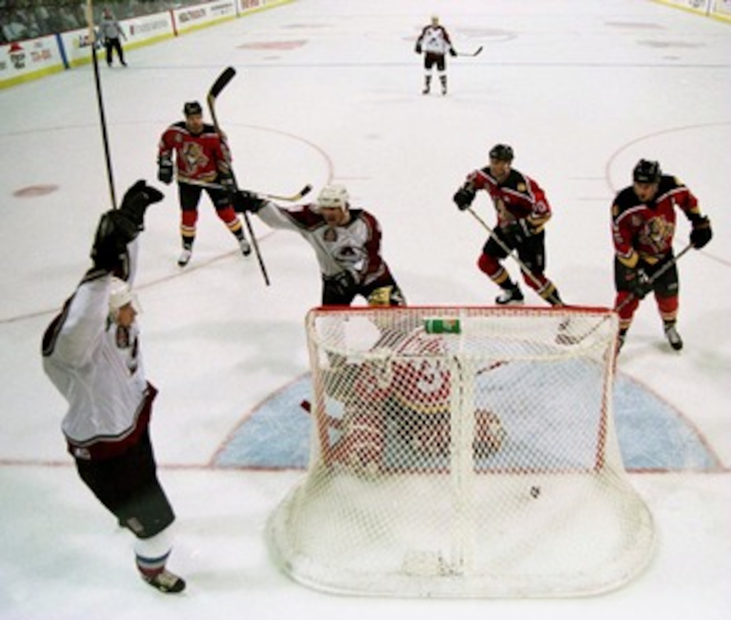 6 June 1996:  Colorado Avalanche center Peter Forsberg (left) celebrates his third goal of the game as teammate Adam Deadmarsh (center) joins him as the Avalanche lead the game 4-1 during the first period. The Stanley Cup Finals game two was played at McN