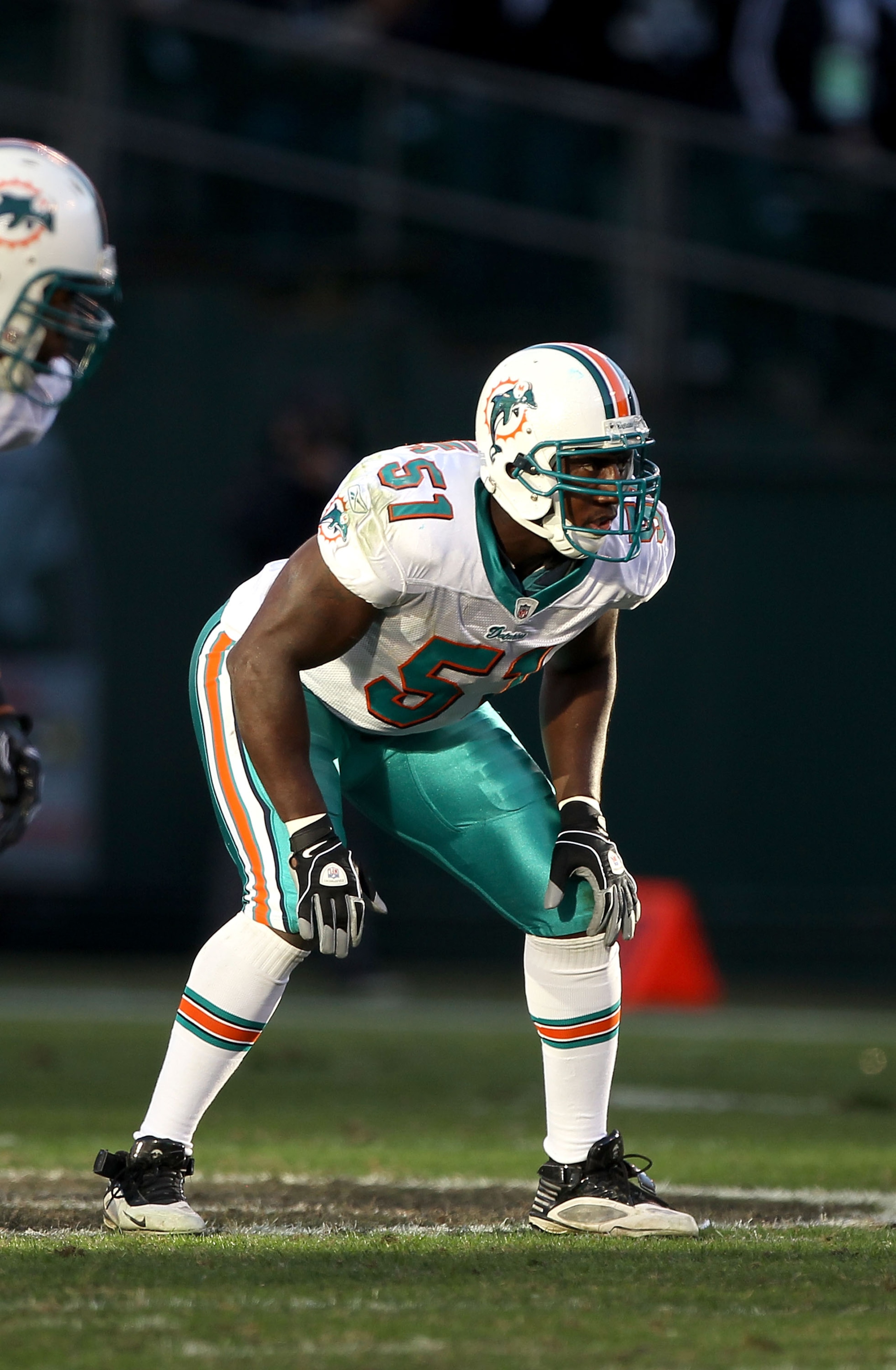 OAKLAND, CA - NOVEMBER 28:  Tim Dobbins #51 of the Miami Dolphins in action against the Oakland Raiders at Oakland-Alameda County Coliseum on November 28, 2010 in Oakland, California.  (Photo by Ezra Shaw/Getty Images)