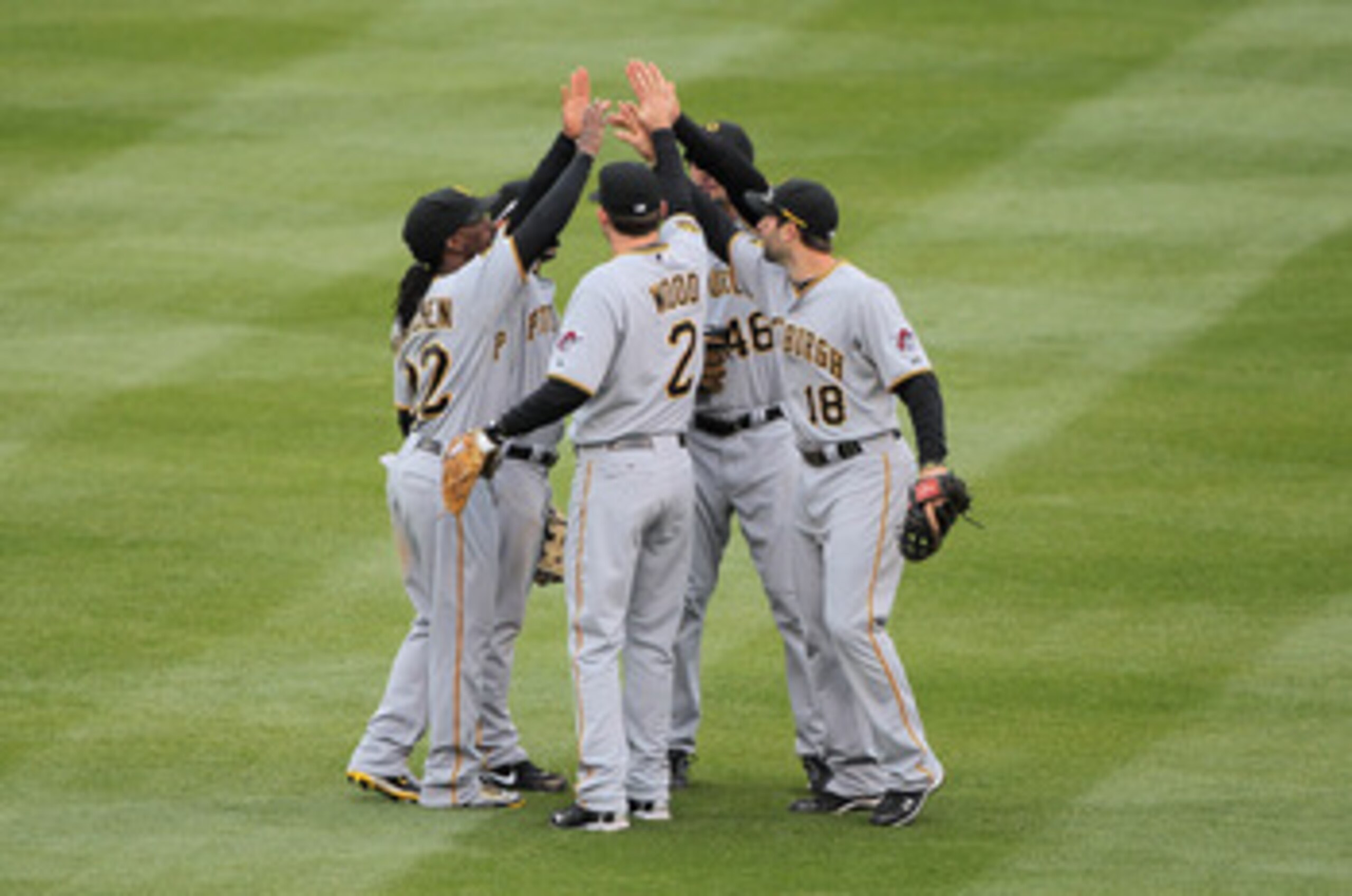 DENVER, CO - MAY 01: Xavier Paul #38, Andrew McCutchen #22, Brandon Wood #2, Garrett Jones #46, and Neil Walker #18 of the Pittsburgh Pirates celebrate their victory over the Colorado Rockies at Coors Field on May 1, 2011 in Denver, Colorado. The Pirates DENVER, CO - MAY 01: Xavier Paul #38, Andrew McCutchen #22, Brandon Wood #2, Garrett Jones #46, and Neil Walker #18 of the Pittsburgh Pirates celebrate their victory over the Colorado Rockies at Coors Field on May 1, 2011 in Denver, Colorado. The Pirates