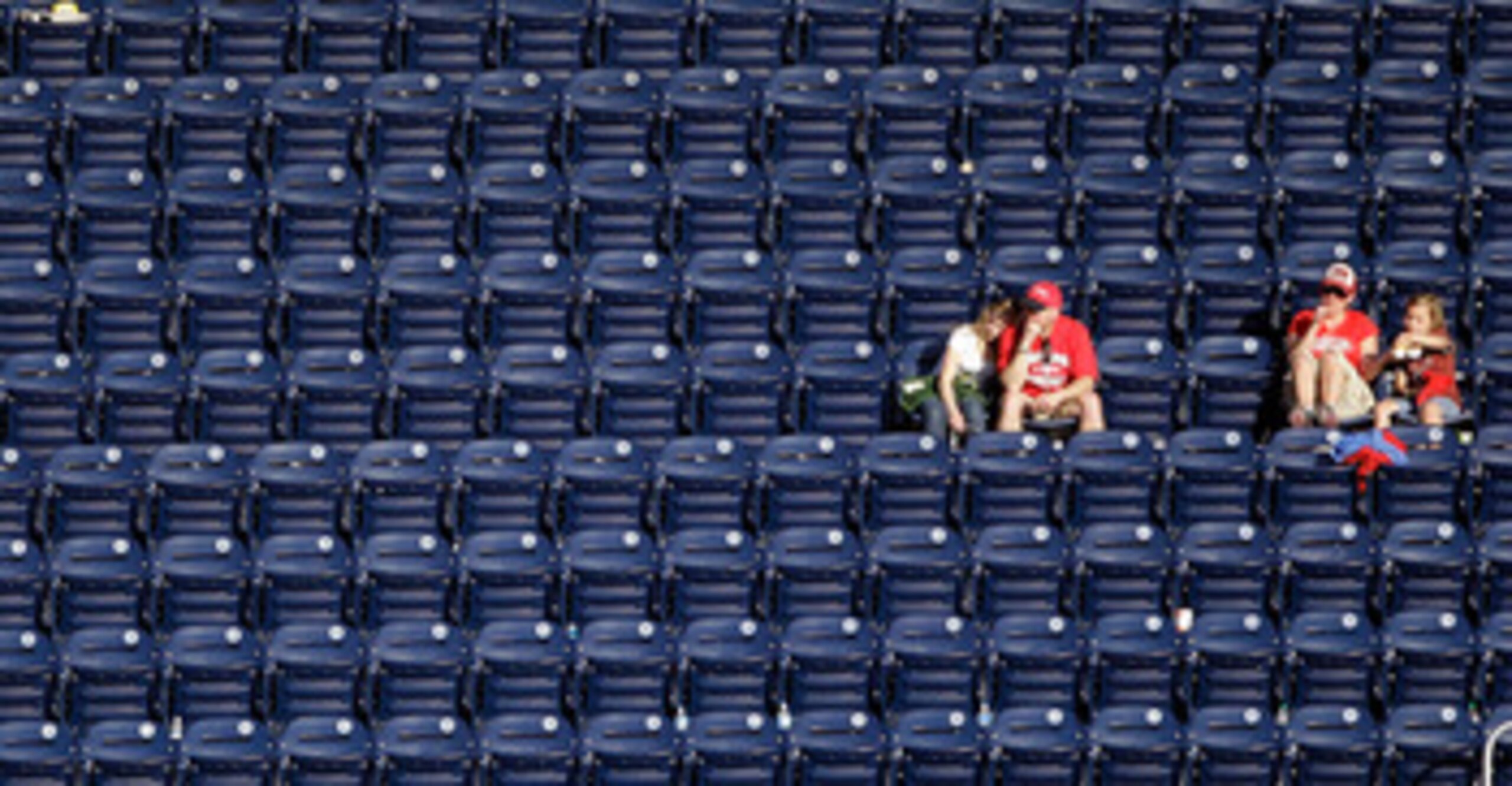 WASHINGTON, DC - APRIL 17:  Fans watch from the upper deck during a game between the Washington Nationals and the Milwaukee Brewers during the second game of a doubleheader at Nationals Park on April 17, 2011 in Washington, DC.  (Photo by Rob Carr/Getty I
