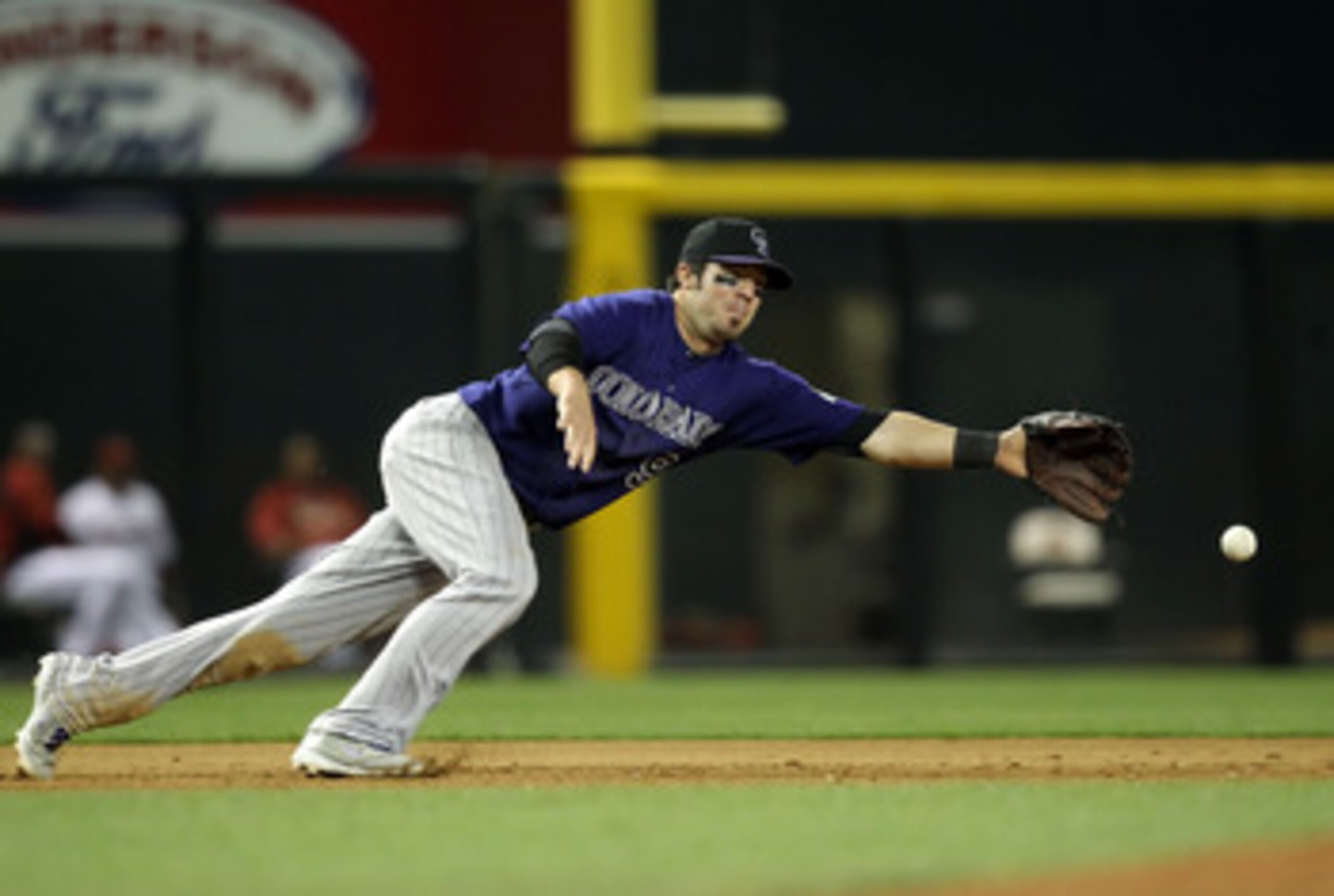PHOENIX, AZ - MAY 05:  Infielder Ian Stewart #9 of the Colorado Rockies makes a diving attempt at a single hit by the Arizona Diamondbacks during the Major League Baseball game at Chase Field on May 5, 2011 in Phoenix, Arizona.  (Photo by Christian Peters
