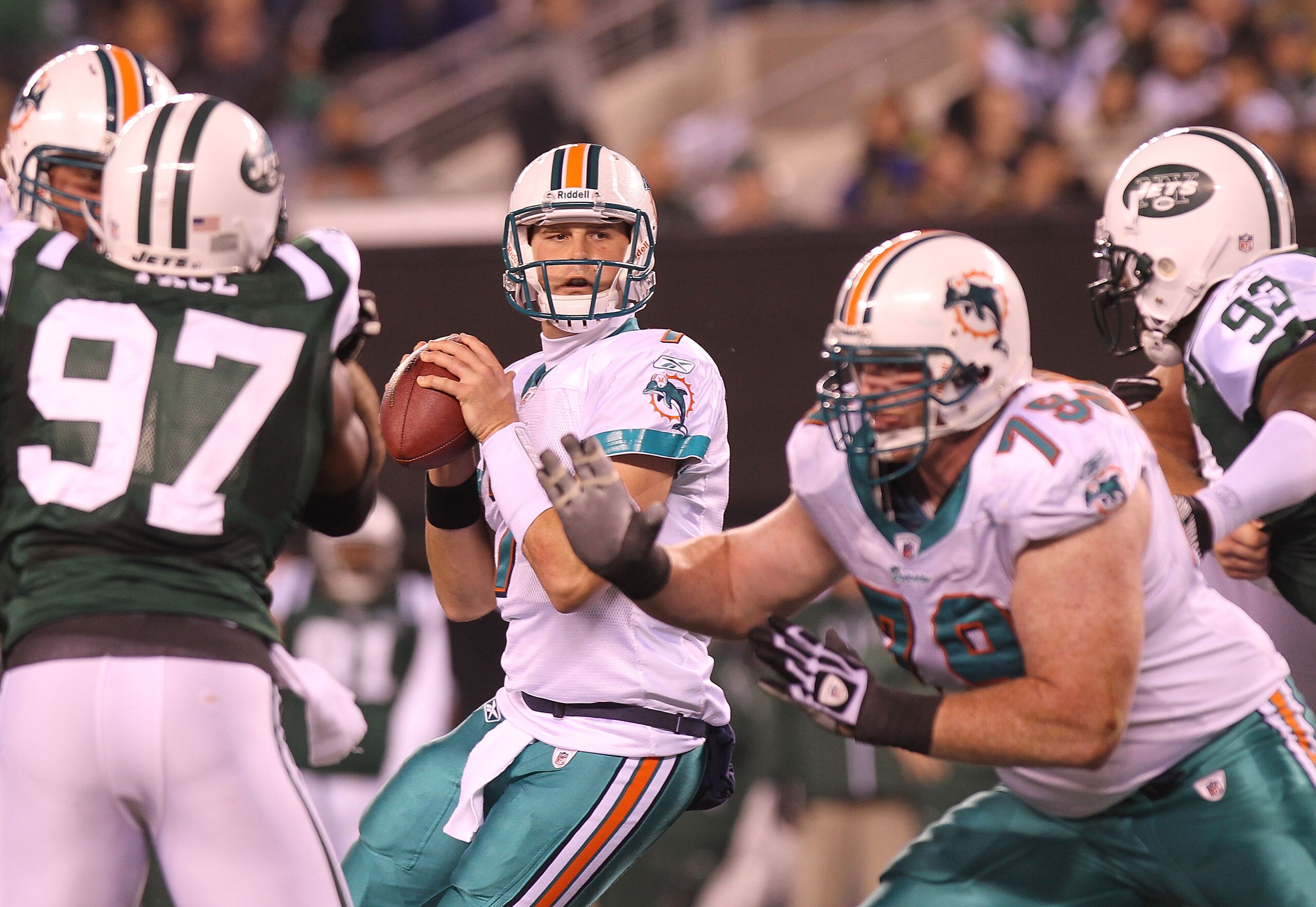 EAST RUTHERFORD, NJ - DECEMBER 12:  Chad Henne #7 of the Miami Dolphins drops back to pass against the New York Jets at New Meadowlands Stadium on December 12, 2010 in East Rutherford, New Jersey.  (Photo by Nick Laham/Getty Images)