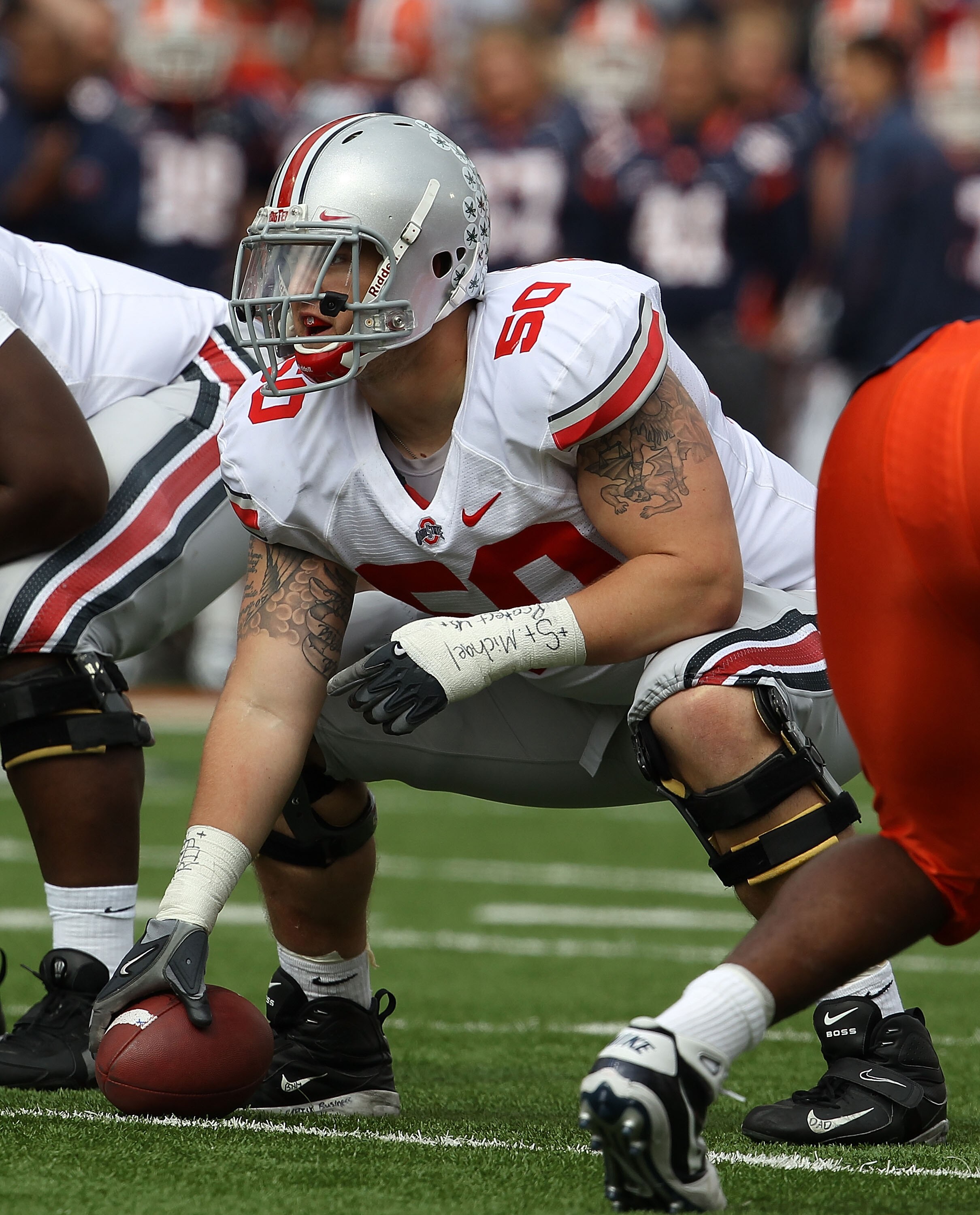 CHAMPAIGN, IL - OCTOBER 02: Mike Brewster #50 of the Ohio State Buckeyes waits to snap the ball against the Illinois Fighting Illini at Memorial Stadium on October 2, 2010 in Champaign, Illinois. Ohio State defeated Illinois 24-13. (Photo by Jonathan Dani
