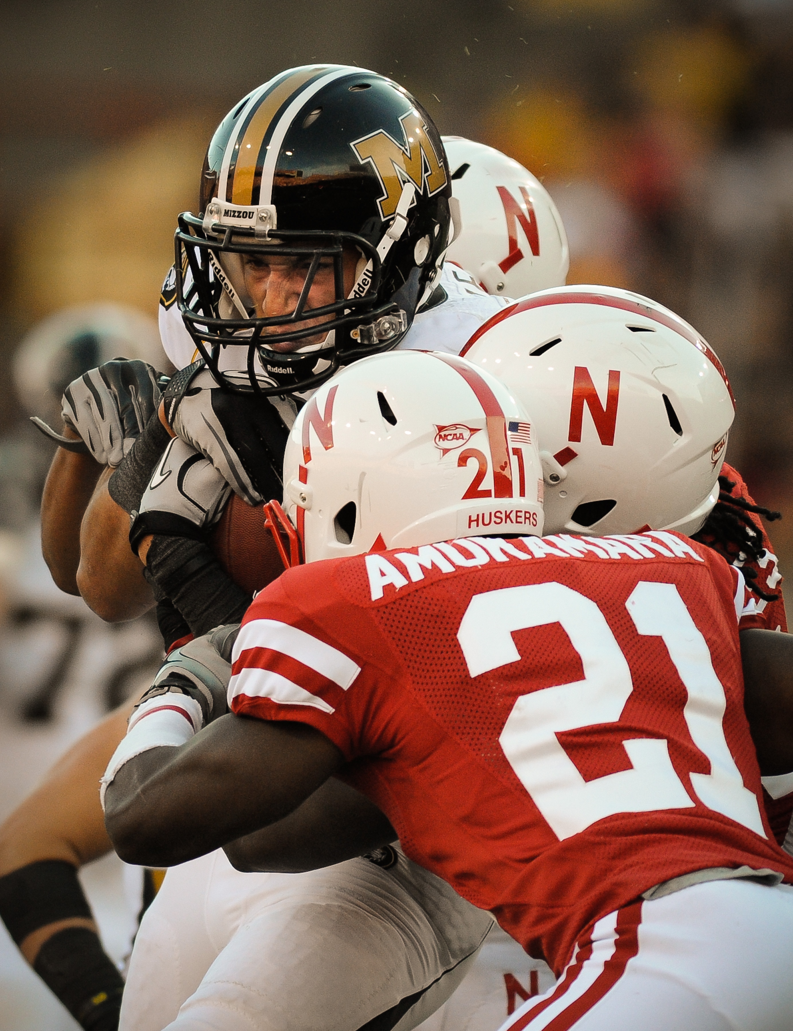 LINCOLN, NE - OCTOBER 30: Tight end Michael Egnew #82 of the Missouri Tigers takes a hit from cornerback Prince Amukamara #21 and teammates of the Nebraska Cornhuskers during second half action of their game at Memorial Stadium on October 30, 2010 in Linc