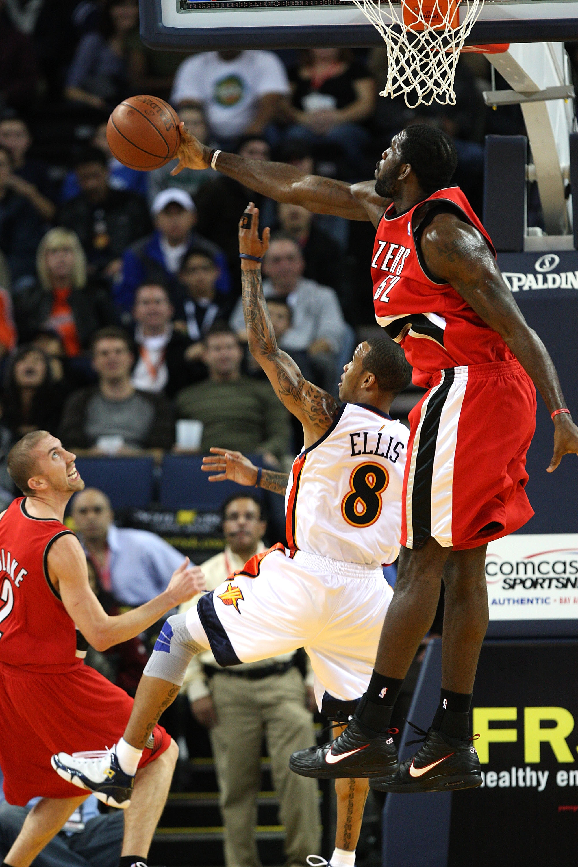 OAKLAND, CA - NOVEMBER 20:  Greg Oden #52 of the Portland Trail Blazers blocks a shot by Monta Ellis #8 of the Golden State Warriors during an NBA game at Oracle Arena on November 20, 2009 in Oakland, California.  (Photo by Jed Jacobsohn/Getty Images)