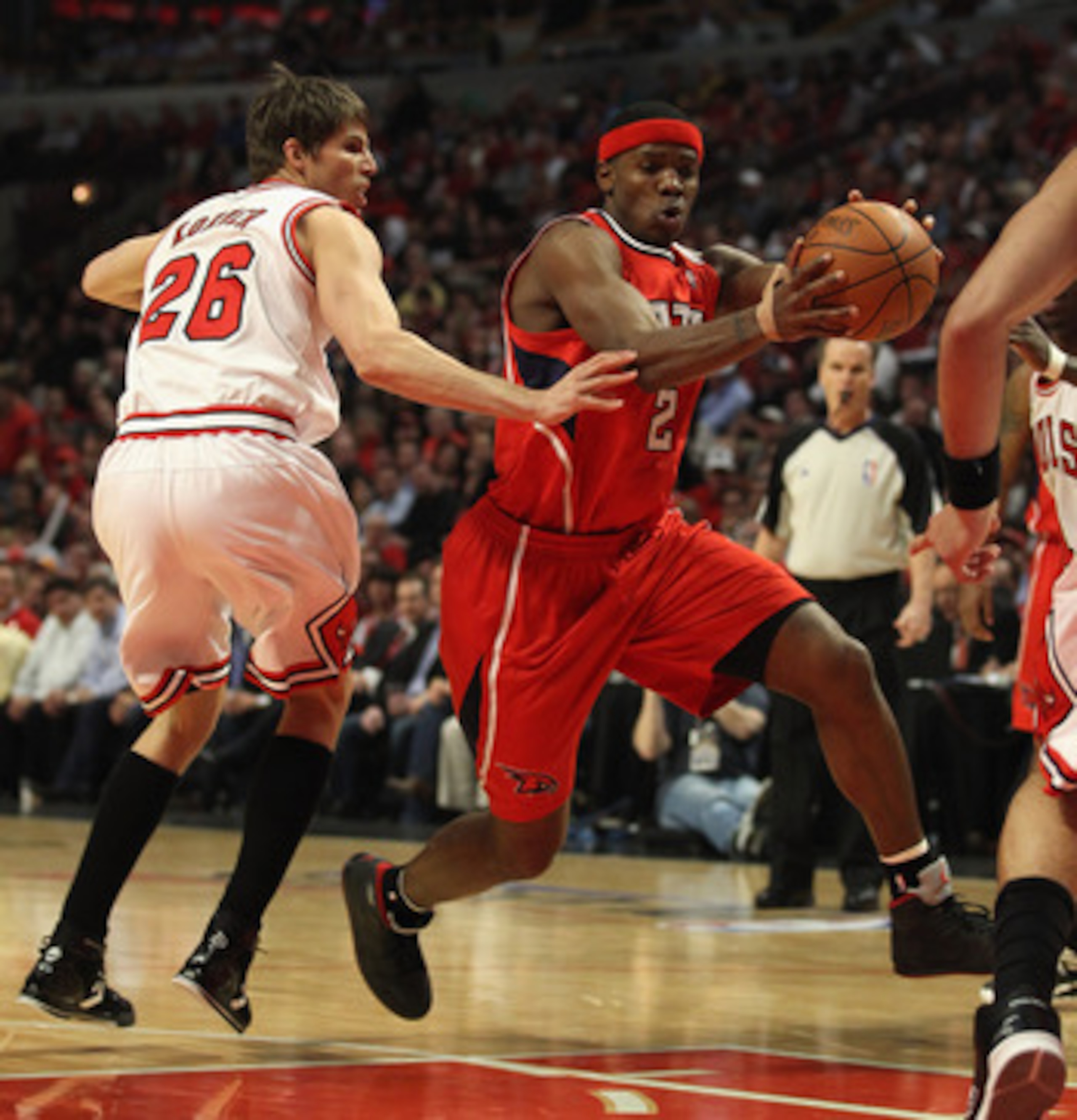 CHICAGO, IL - MAY 04: Joe Johnson #2 of the Atlanta Hawks drives past Kyle Korver #26 of the Chicago Bulls in Game Two of the Eastern Conference Semifinals in the 2011 NBA Playoffs at the United Center on May 4, 2011 in Chicago, Illinois. The Bulls defeat
