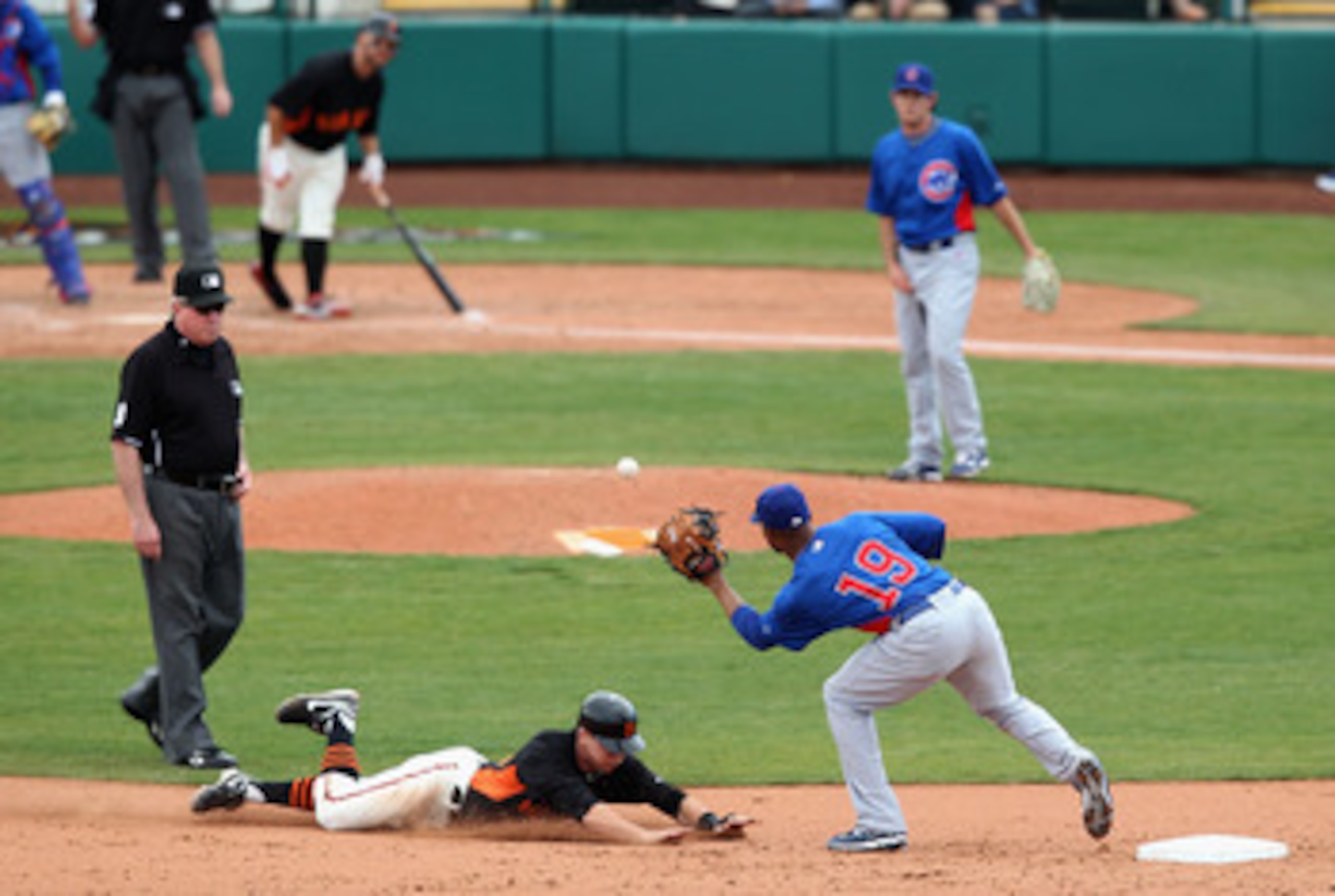 SCOTTSDALE, AZ - MARCH 01:  Gary Brown #86 of the San Francisco Giants safely steals second base under the tag from infielder Bobby Scales #19 of the Chicago Cubs during the spring training game at Scottsdale Stadium on March 1, 2011 in Scottsdale, Arizon