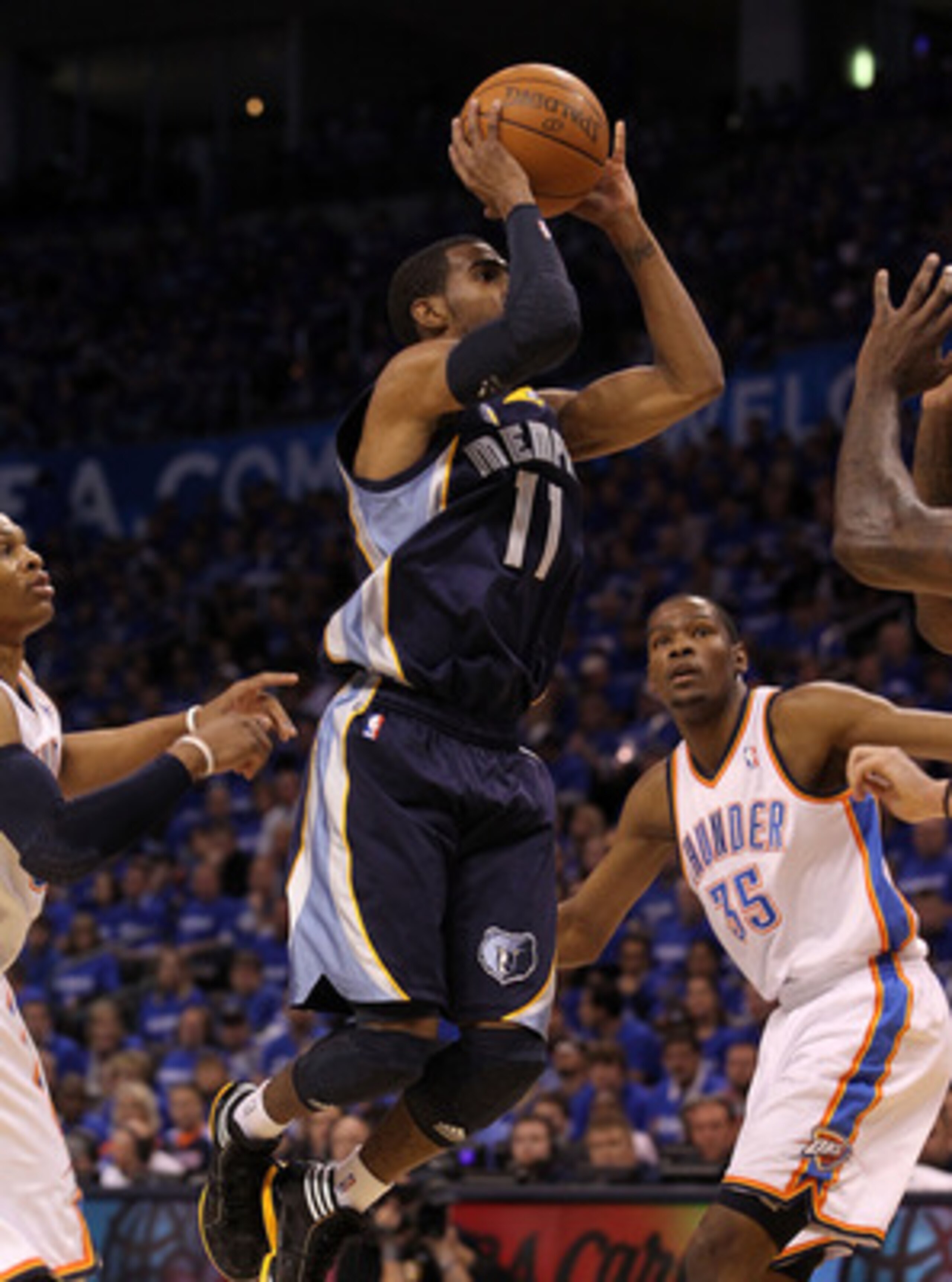 OKLAHOMA CITY, OK - MAY 01:  Guard Mike Conley #11 of the Memphis Grizzlies takes a shot against the Oklahoma City Thunder in Game One of the Western Conference Semifinals in the 2011 NBA Playoffs on May 1, 2011 at Oklahoma City Arena in Oklahoma City, Ok