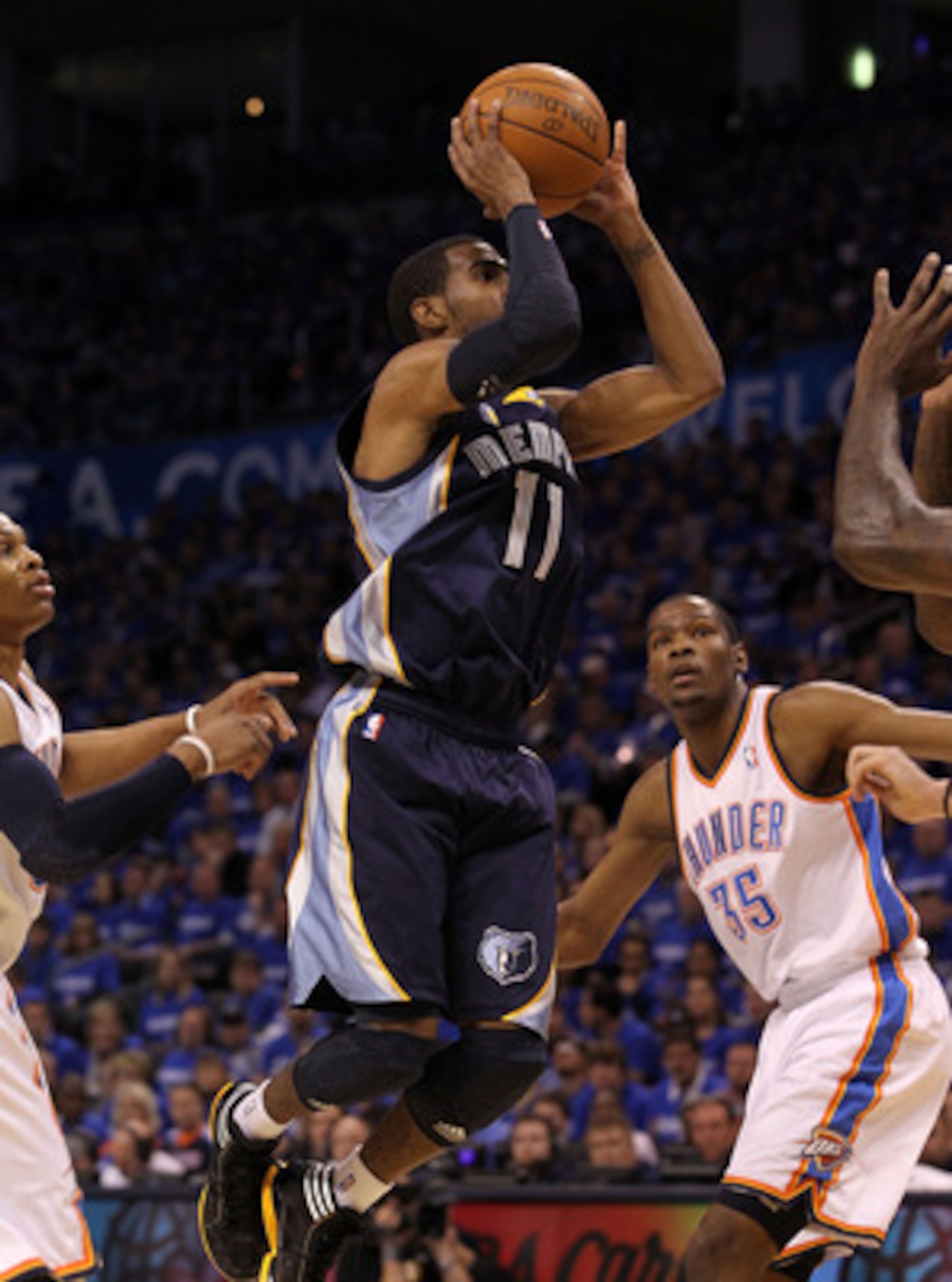 OKLAHOMA CITY, OK - MAY 01:  Guard Mike Conley #11 of the Memphis Grizzlies takes a shot against the Oklahoma City Thunder in Game One of the Western Conference Semifinals in the 2011 NBA Playoffs on May 1, 2011 at Oklahoma City Arena in Oklahoma City, Ok