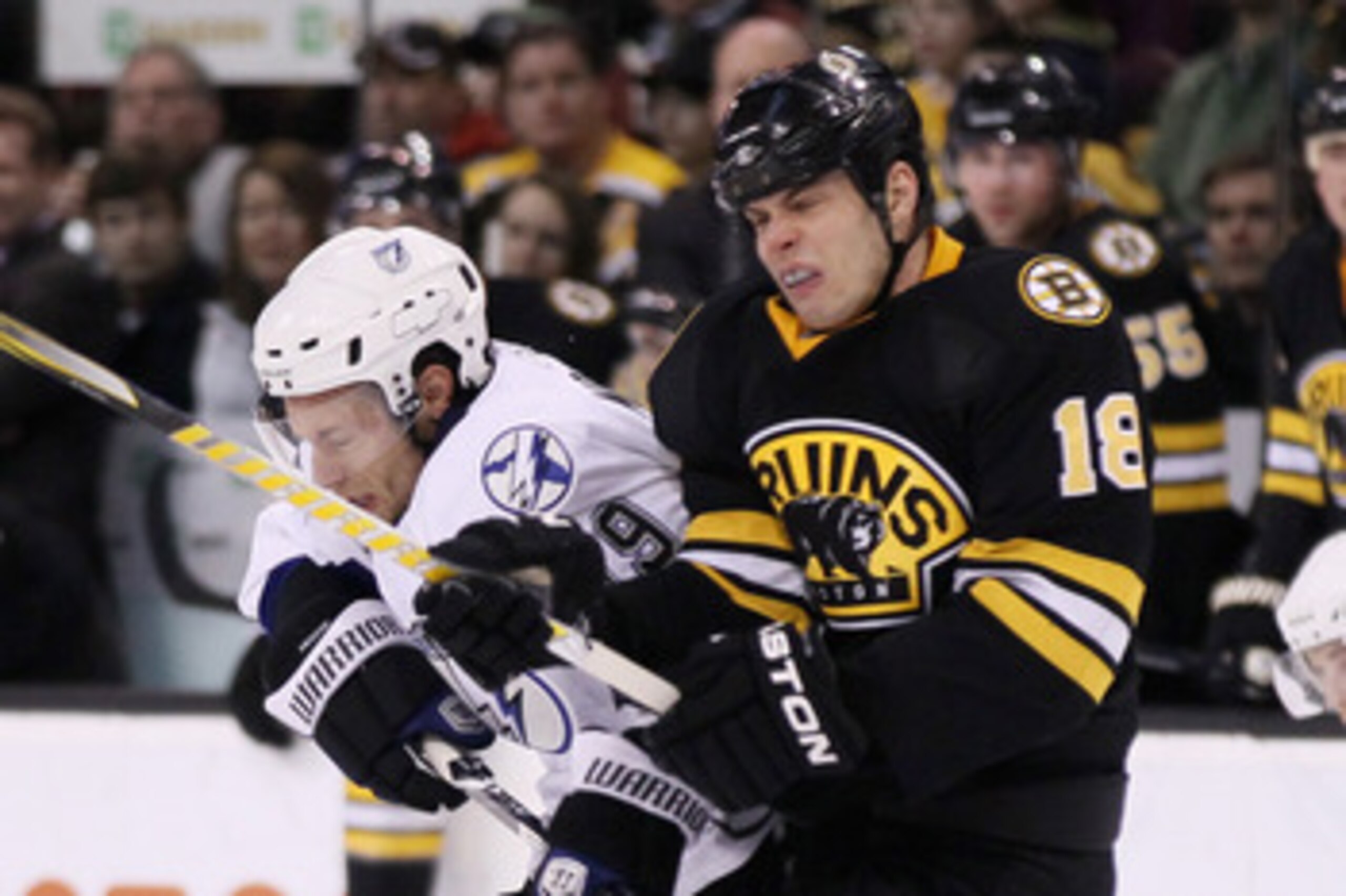 BOSTON, MA - MARCH 03: Nathan Horton #18 of the Boston Bruins and Dominic Moore #19 of the Tampa Bay Lightning collide in the second period on March 3, 2011 at the TD Garden in Boston, Massachusetts. (Photo by Elsa/Getty Images) BOSTON, MA - MARCH 03: Nathan Horton #18 of the Boston Bruins and Dominic Moore #19 of the Tampa Bay Lightning collide in the second period on March 3, 2011 at the TD Garden in Boston, Massachusetts. (Photo by Elsa/Getty Images)