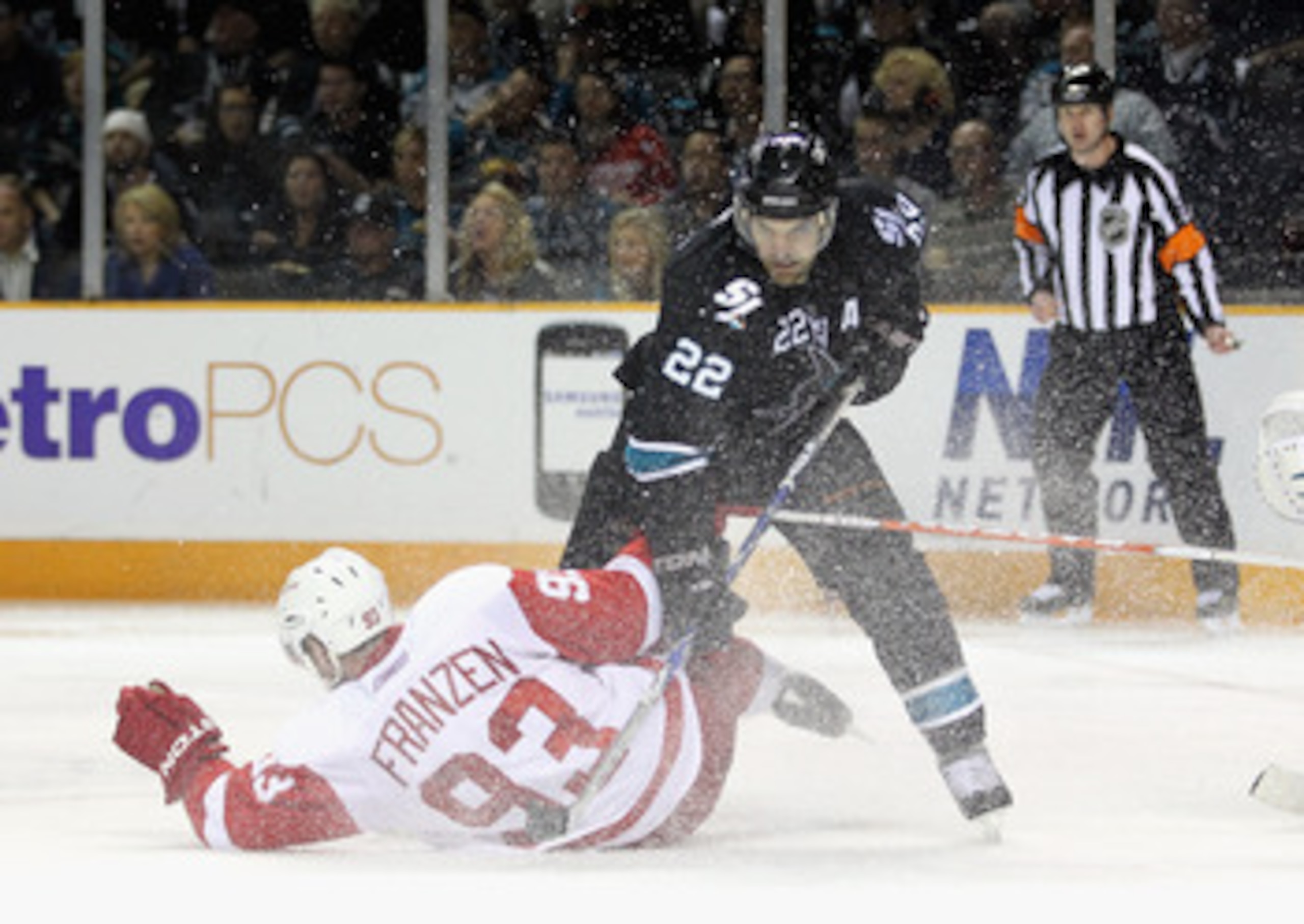 SAN JOSE, CA - MAY 01:  Johan Franzen #93 of the Detroit Red Wings and Dan Boyle #22 of the San Jose Sharks collide in Game Two of the Western Conference Semifinals during the 2011 NHL Stanley Cup Playoffs at HP Pavilion on May 1, 2011 in San Jose, Califo