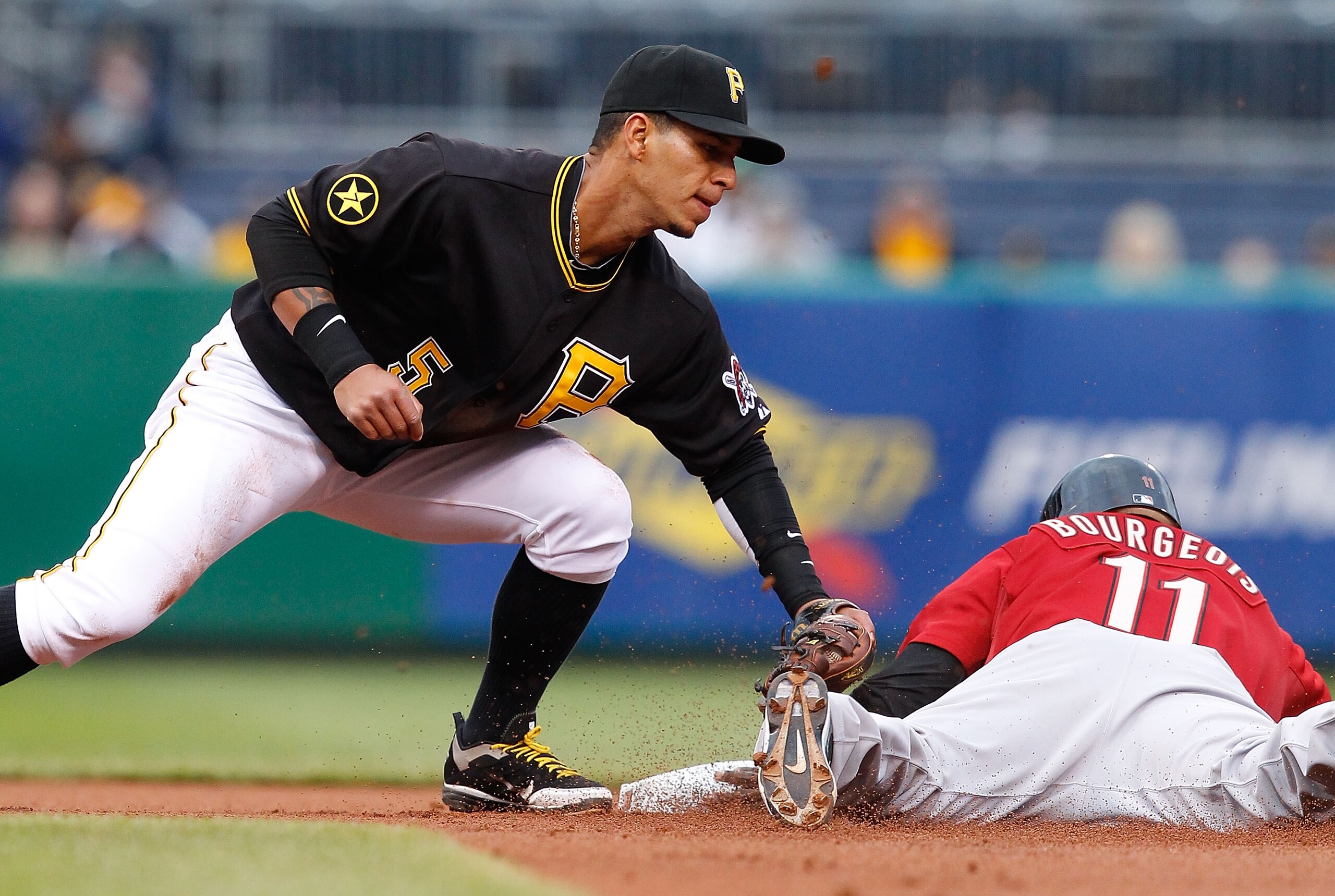 PITTSBURGH - MAY 06: Ronny Cedeno #5 of the Pittsburgh Pirates attempts to tag out Jason Bourgeois #11 of the Houston Astros during the game on May 6, 2011 at PNC Park in Pittsburgh, Pennsylvania. (Photo by Jared Wickerham/Getty Images) PITTSBURGH - MAY 06: Ronny Cedeno #5 of the Pittsburgh Pirates attempts to tag out Jason Bourgeois #11 of the Houston Astros during the game on May 6, 2011 at PNC Park in Pittsburgh, Pennsylvania. (Photo by Jared Wickerham/Getty Images)