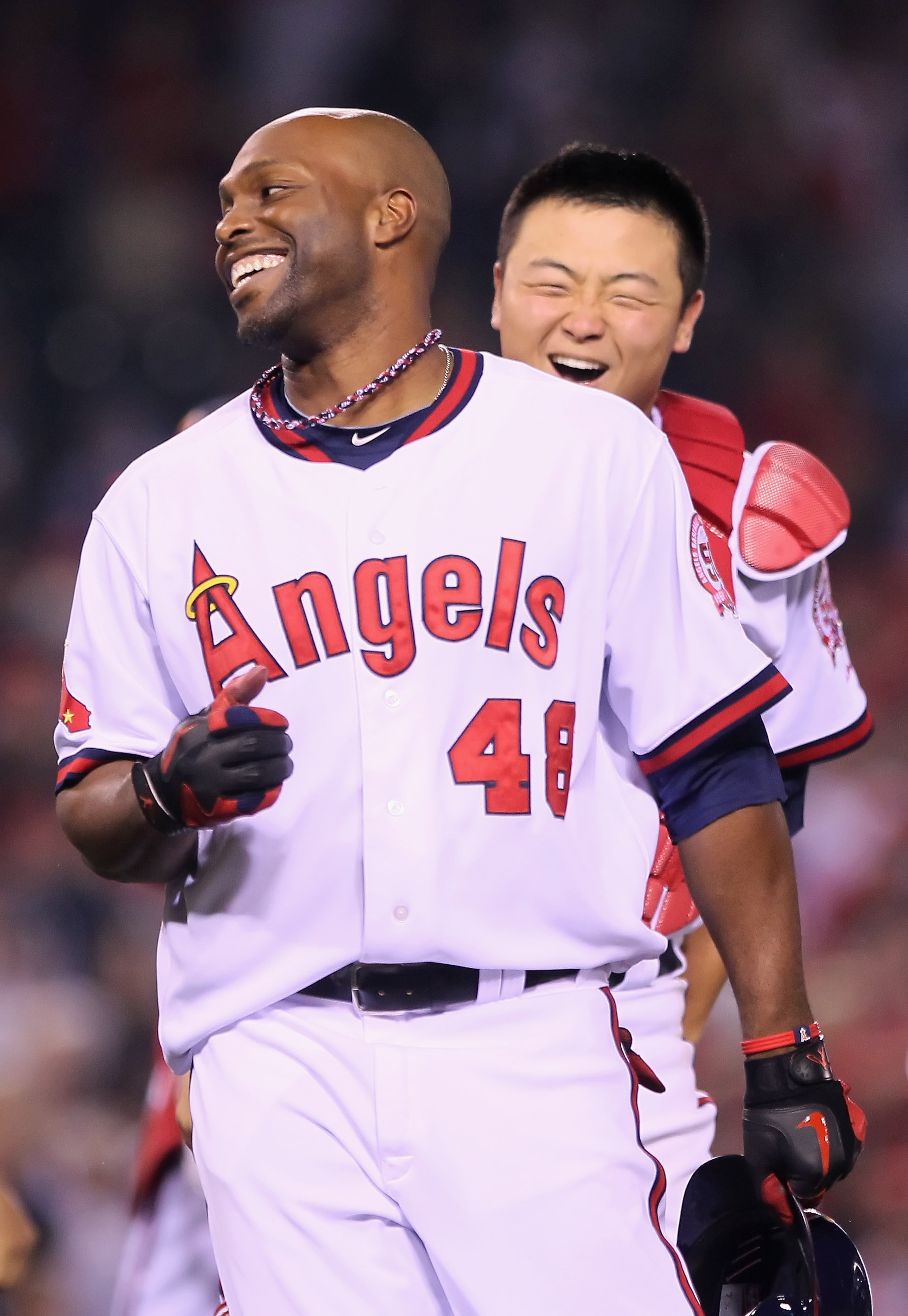 ANAHEIM, CA - MAY 06: Torii Hunter #48 of the Los Angeles Angels of Anaheim is congratulated by Hank Conger #16 after hitting the game wining RBI single against the Cleveland Indians in the 11th inning at Angel Stadium of Anaheim on May 6, 2011 in Anahei ANAHEIM, CA - MAY 06: Torii Hunter #48 of the Los Angeles Angels of Anaheim is congratulated by Hank Conger #16 after hitting the game wining RBI single against the Cleveland Indians in the 11th inning at Angel Stadium of Anaheim on May 6, 2011 in Anahei