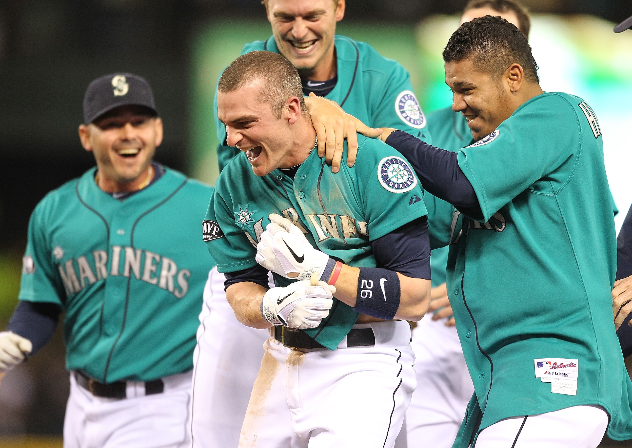 SEATTLE - MAY 06: Brendan Ryan #26 of the Seattle Mariners is mobbed by teammates including starting pitcher Felix Hernandez #34 (R) after driving in the winning run in the ninth inning to defeat the Chicago White Sox 3-2 at Safeco Field on May 6, 2011 i SEATTLE - MAY 06: Brendan Ryan #26 of the Seattle Mariners is mobbed by teammates including starting pitcher Felix Hernandez #34 (R) after driving in the winning run in the ninth inning to defeat the Chicago White Sox 3-2 at Safeco Field on May 6, 2011 i