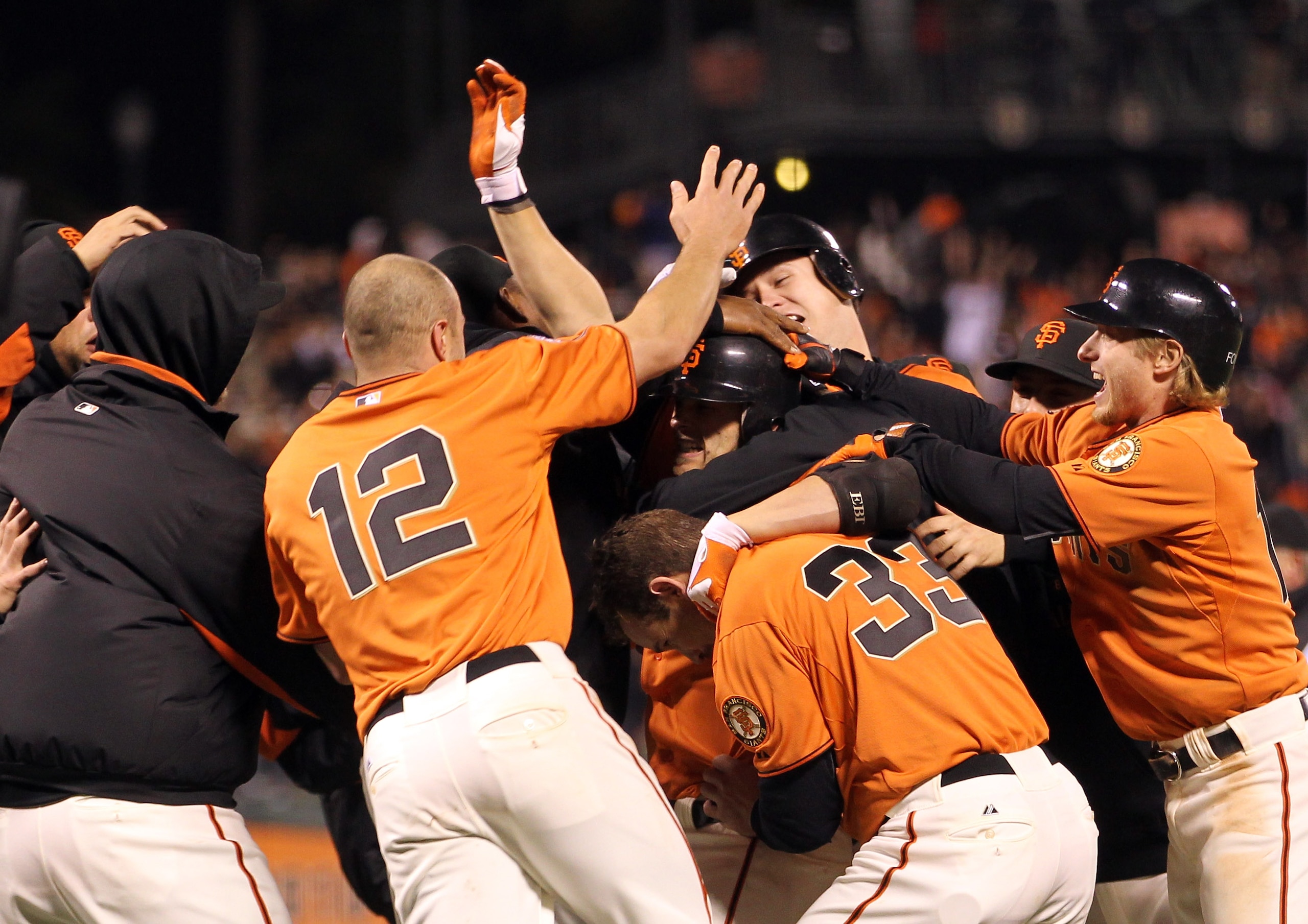 SAN FRANCISCO, CA - MAY 06: Freddy Sanchez #21 of the San Francisco Giants is surrounded by teammates after he drove in Cody Ross #13 to win their game against the Colorado Rockies at AT&T Park on May 6, 2011 in San Francisco, California. (Photo by Ezra SAN FRANCISCO, CA - MAY 06: Freddy Sanchez #21 of the San Francisco Giants is surrounded by teammates after he drove in Cody Ross #13 to win their game against the Colorado Rockies at AT&T Park on May 6, 2011 in San Francisco, California. (Photo by Ezra