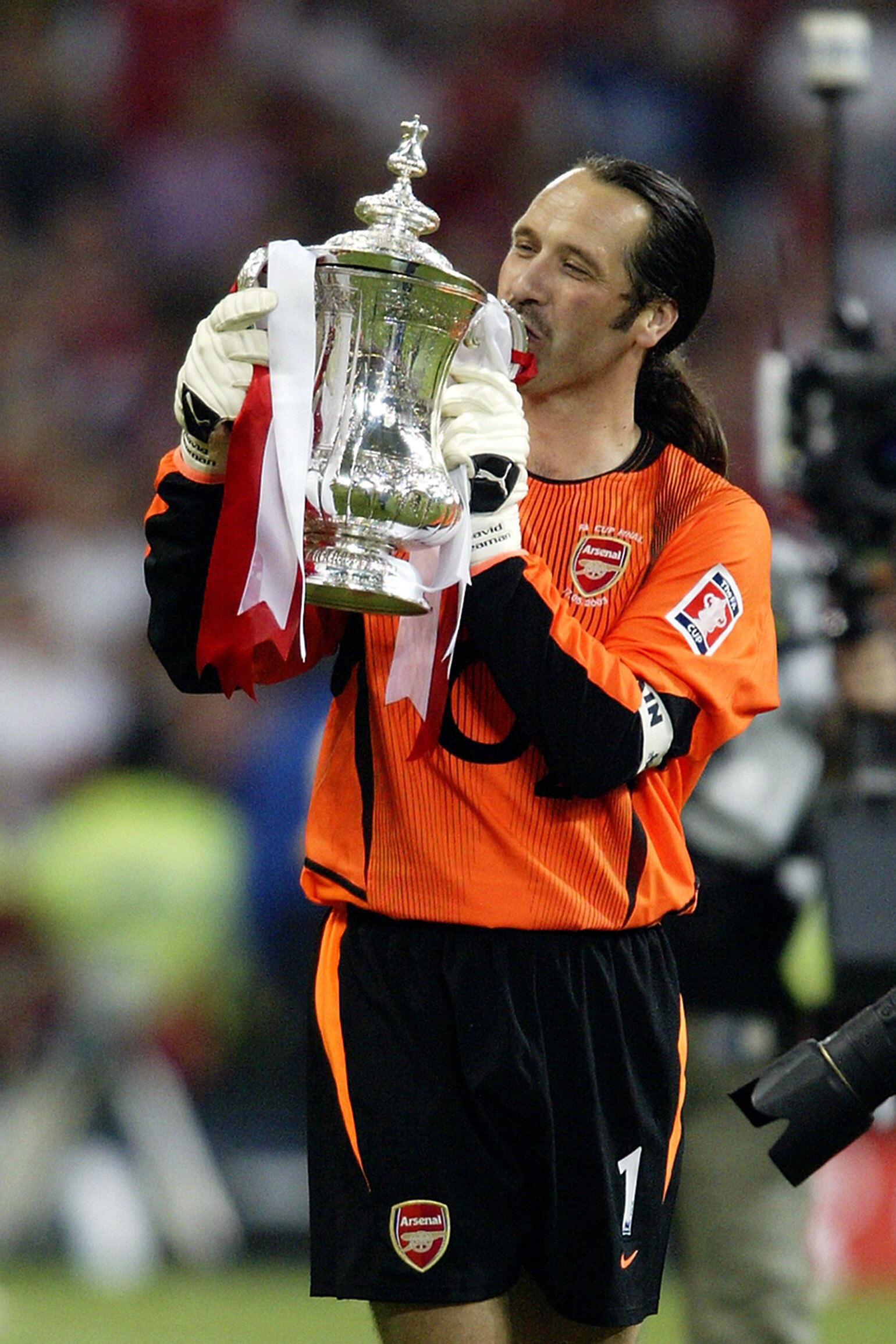 CARDIFF - MAY 17:  David Seaman of Arsenal kisses the FA Cup after winning the FA Cup Final match between Arsenal and Southampton on May 17, 2003 at the Millennium Stadium in Cardiff, Wales.  Arsenal won the match and the FA cup 1-0.  (Photo by Clive Maso