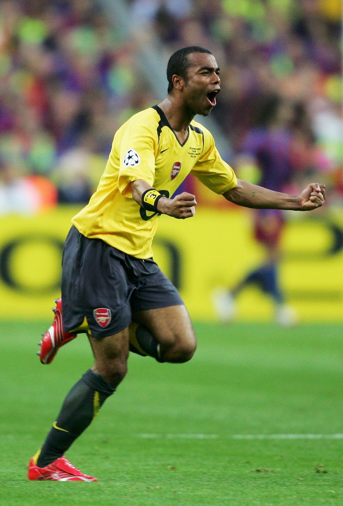 PARIS - MAY 17:  Ashley Cole of Arsenal celebrates as his side score the first goal during the UEFA Champions League Final between Arsenal and Barcelona at the Stade de France on May 17, 2006 in Paris, France.  (Photo by Shaun Botterill/Getty Images)