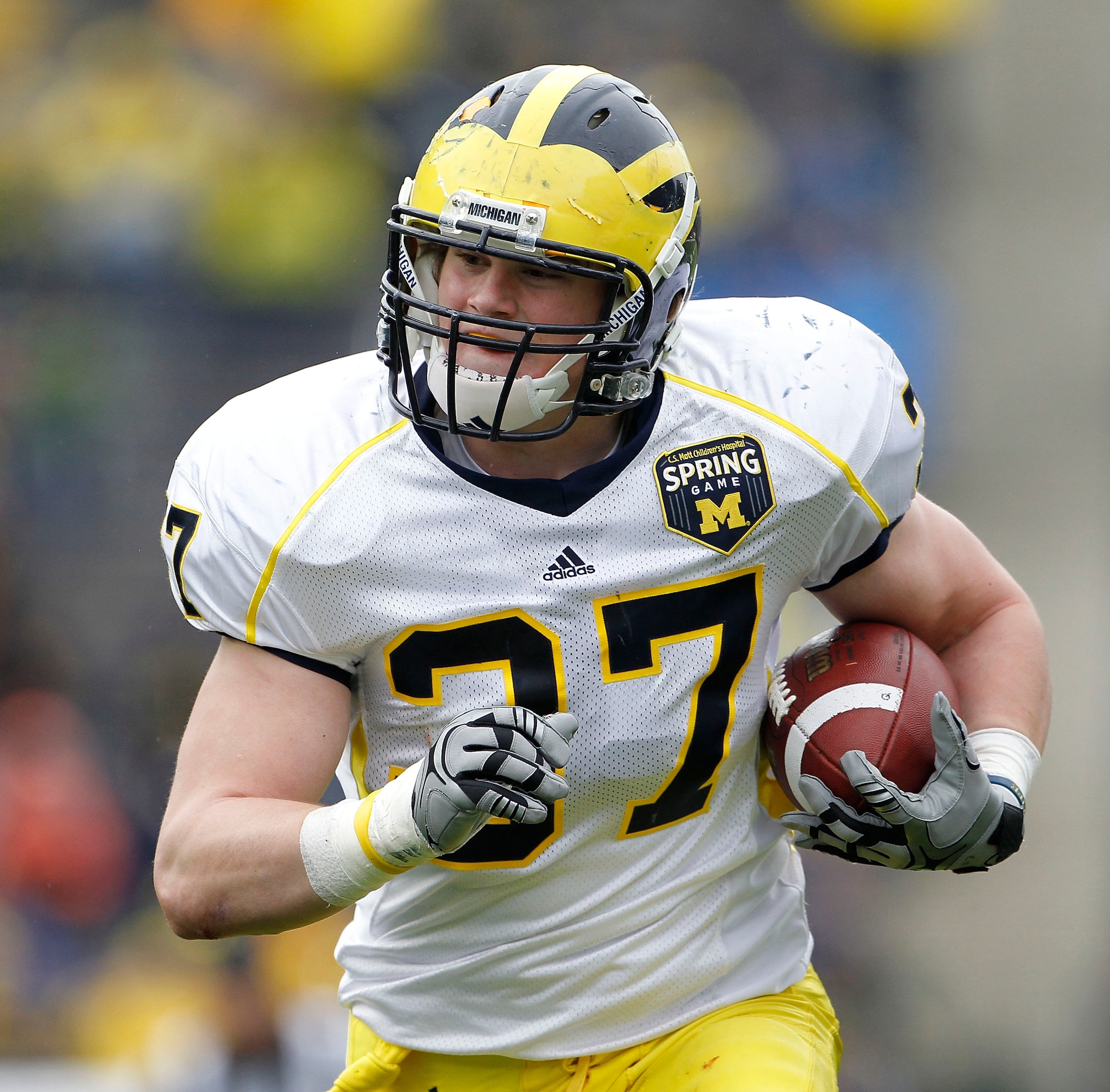 ANN ARBOR, MI - APRIL 16: Jake Ryan #37 of the Michigan Wolverines scores after an interception during the annual Spring Game at Michigan Stadium on April 16, 2011 in Ann Arbor, Michigan.  (Photo by Leon Halip/Getty Images)