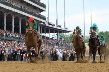 LOUISVILLE, KY - MAY 07:  Jockey John Velazquez, riding Animal Kingdom #16, runs down the front stretch towards the finish line to win the 137th Kentucky Derby at Churchill Downs on May 7, 2011 in Louisville, Kentucky.  (Photo by Matthew Stockman/Getty Im