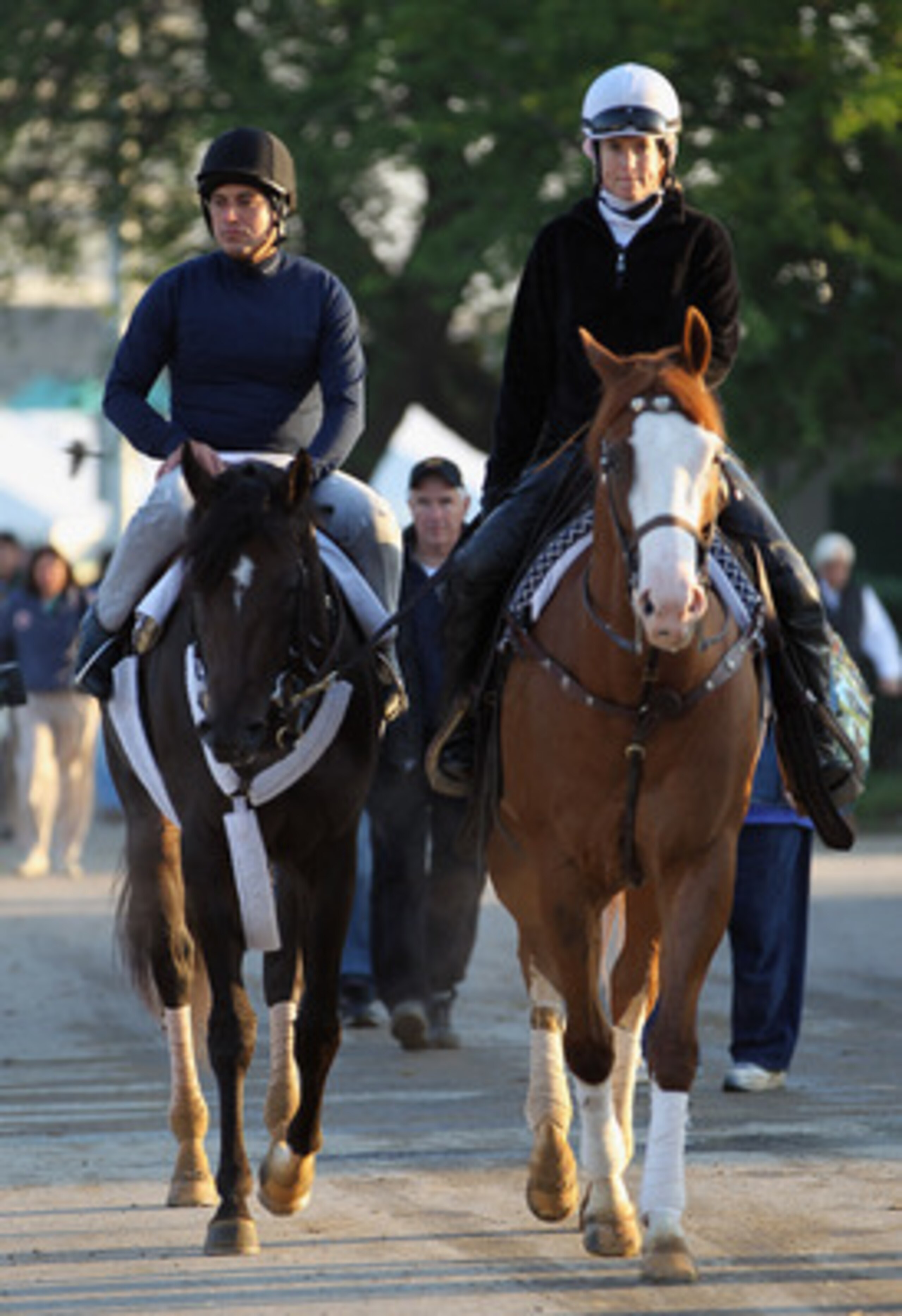 LOUISVILLE, KY - MAY 05:  Kentucky Derby entrant Dialed In with excercise rider Carlos Correa, is led to the track during morning workouts in preparation for the 137th running of the Kentucky Derby on May 5, 2011 at Churchill Downs in Louisville, Kentucky