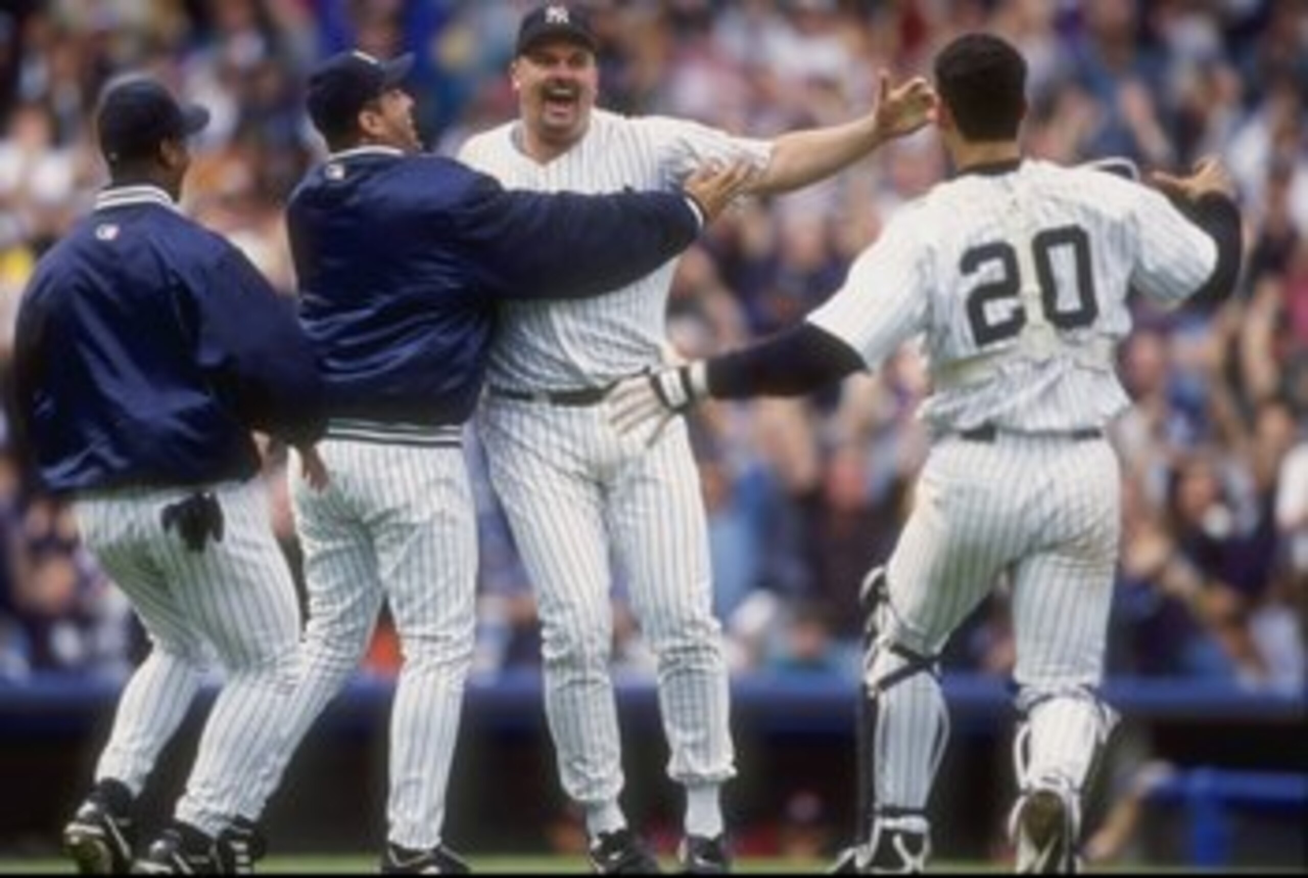 17 May 1998: David Wells #33 of the New York Yankees celebrates his perfect game against the Minnesota Twins with teammates Jorge Posada #20 and Luis Sojo #19 at Yankee Stadium in the Bronx, New York. The Yankees defeated the Twins 4-0.
