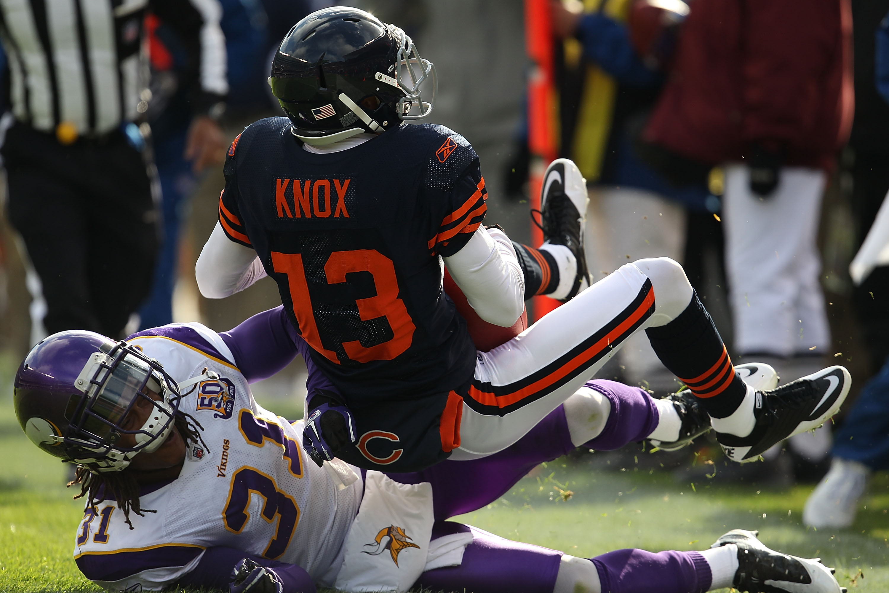 CHICAGO - NOVEMBER 14: Johnny Knox #13 of the Chicago Bears is tackled by Chris Cook #31 of the Minnesota Vikings at Soldier Field on November 14, 2010 in Chicago, Illinois. The Bears defeated the Vikings 27-13. (Photo by Jonathan Daniel/Getty Images)