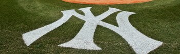 NEW YORK, NY - MARCH 31:  The New York Yankees and the Detroit Tigers look on as West Point Cadets unfurl the American Flag during the opening ceremonies on Opening Day at Yankee Stadium on March 31, 2011 in Bronx borough of New York City.  (Photo by Nick