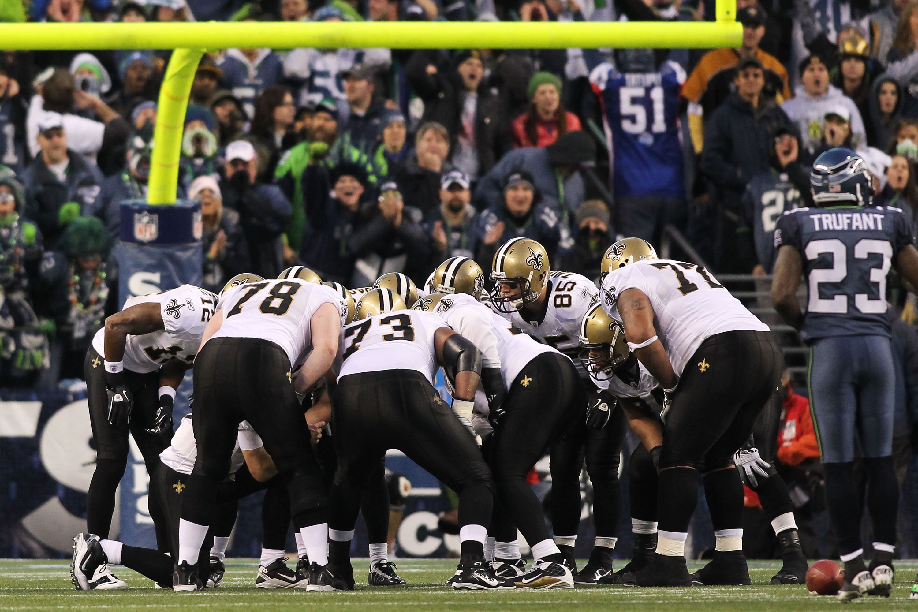 SEATTLE, WA - JANUARY 08:  The New Orleans Saints huddle against the Seattle Seahawks during the 2011 NFC wild-card playoff game at Qwest Field on January 8, 2011 in Seattle, Washington.  (Photo by Jonathan Ferrey/Getty Images)