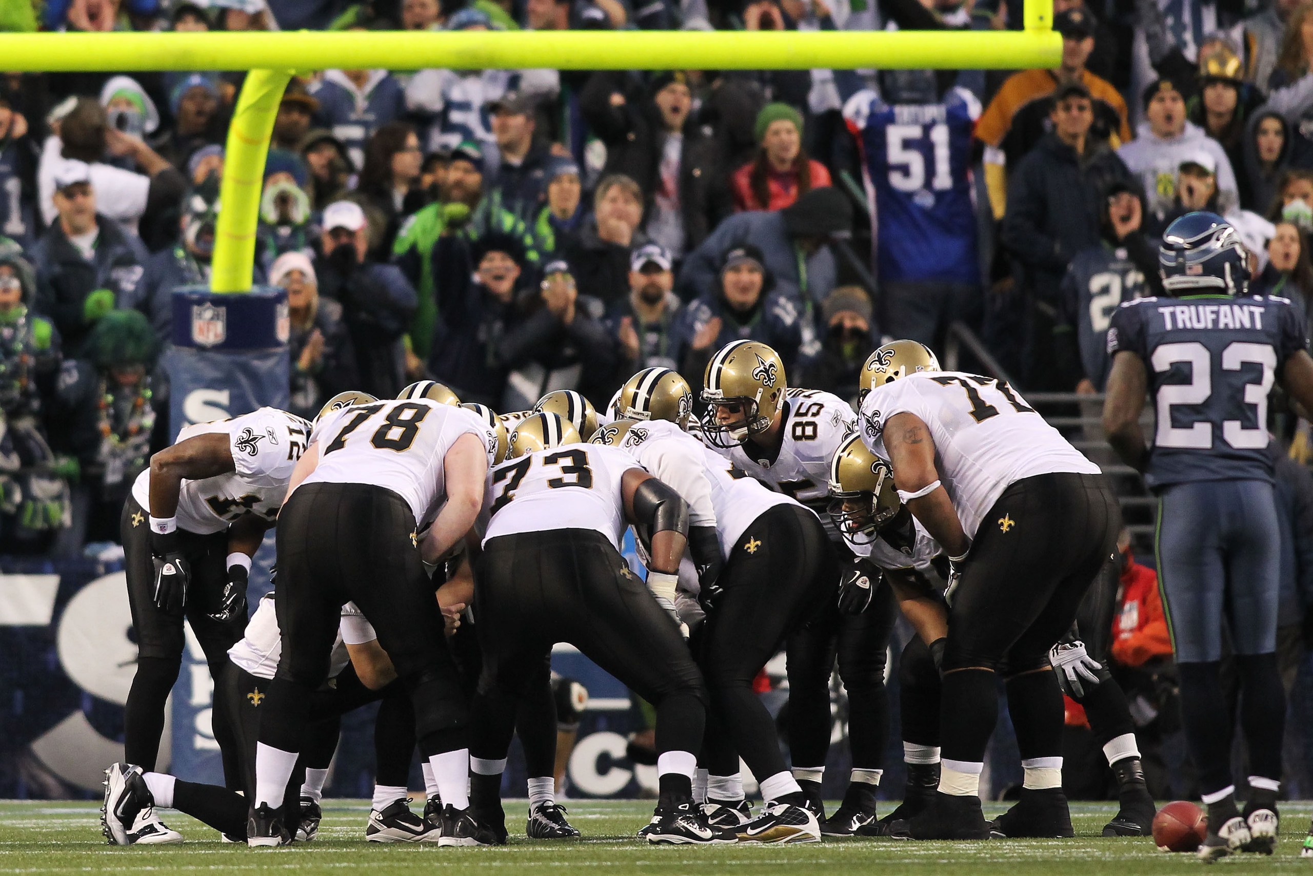 SEATTLE, WA - JANUARY 08:  The New Orleans Saints huddle against the Seattle Seahawks during the 2011 NFC wild-card playoff game at Qwest Field on January 8, 2011 in Seattle, Washington.  (Photo by Jonathan Ferrey/Getty Images)