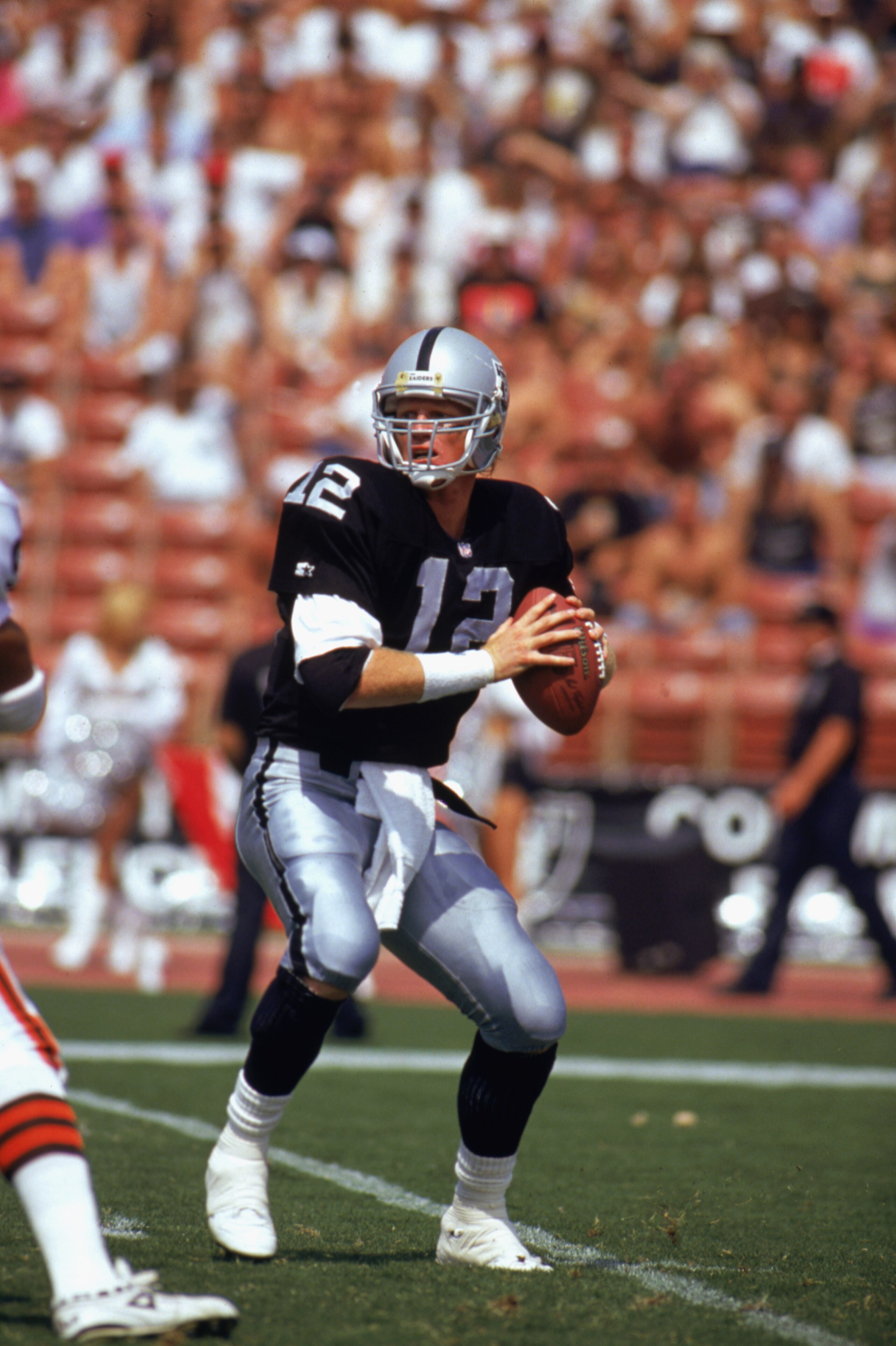 LOS ANGELES -SEPTEMBER 20:  Todd Marinovich #12 of the Los Angeles Raiders looks to pass during the game against the Cleveland Browns at Los Angeles Coliseum on September 20, 1992 in Los Angeles, California. The Browns won 28-16. (Photo by: Ken Levine/Get