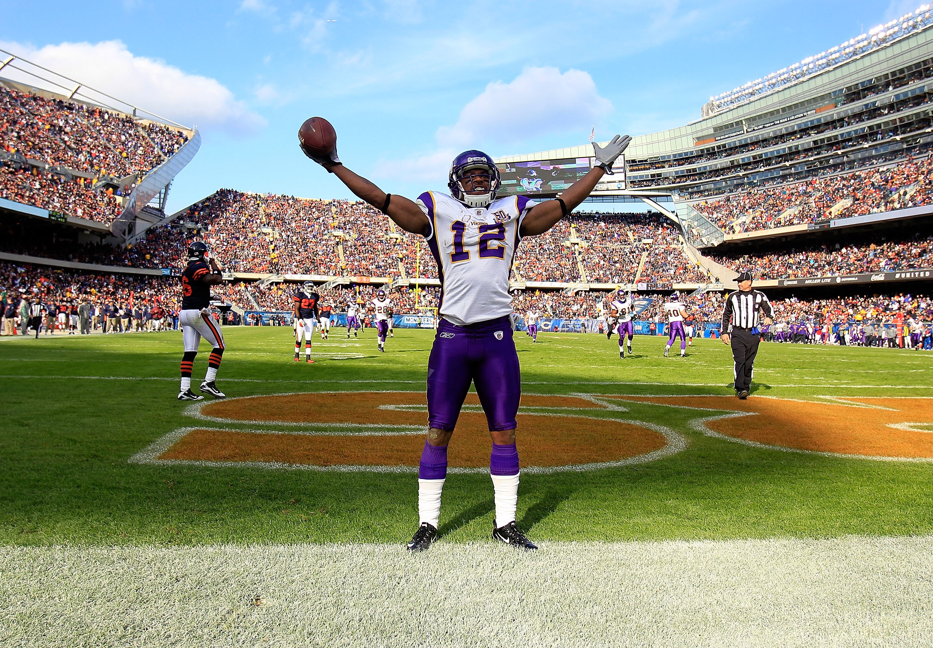 CHICAGO - NOVEMBER 14: Percey Harvin #12 of the Minnesota Vikings celebrates a touchdown catch against the Chicago Bears at Soldier Field on November 14, 2010 in Chicago, Illinois. The Bears defeated the Vikings 27-13. (Photo by Jonathan Daniel/Getty Imag