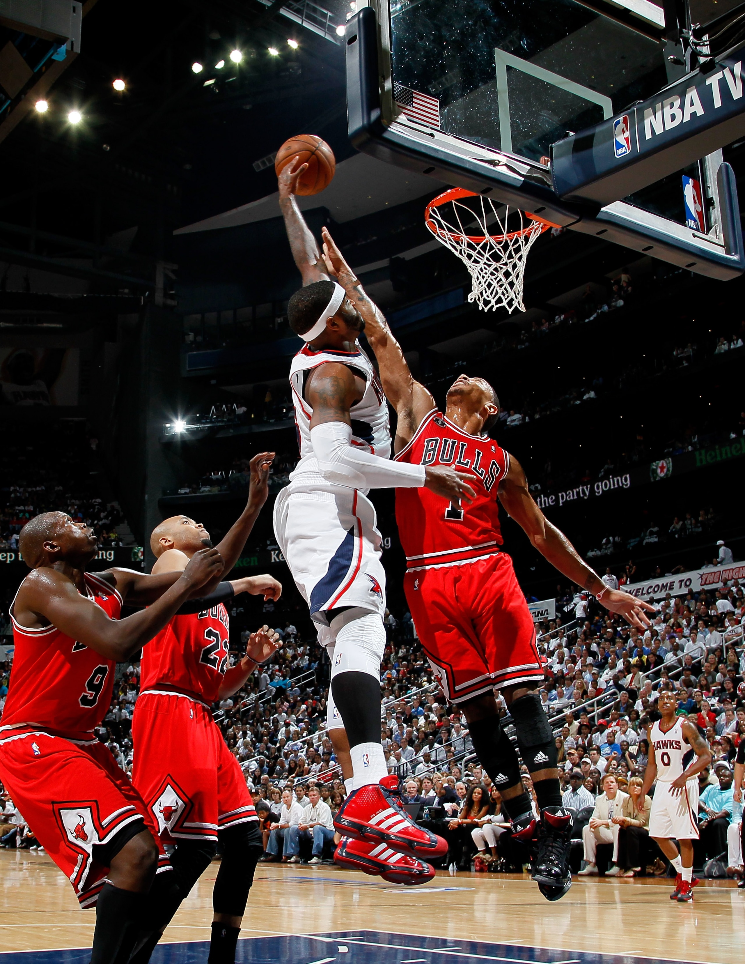 ATLANTA, GA - MAY 06: Derrick Rose #1 of the Chicago Bulls defends a dunk by Josh Smith #5 of the Atlanta Hawks in Game Three of the Eastern Conference Semifinals in the 2011 NBA Playoffs at Phillips Arena on May 6, 2011 in Atlanta, Georgia. NOTE TO USE ATLANTA, GA - MAY 06: Derrick Rose #1 of the Chicago Bulls defends a dunk by Josh Smith #5 of the Atlanta Hawks in Game Three of the Eastern Conference Semifinals in the 2011 NBA Playoffs at Phillips Arena on May 6, 2011 in Atlanta, Georgia. NOTE TO USE
