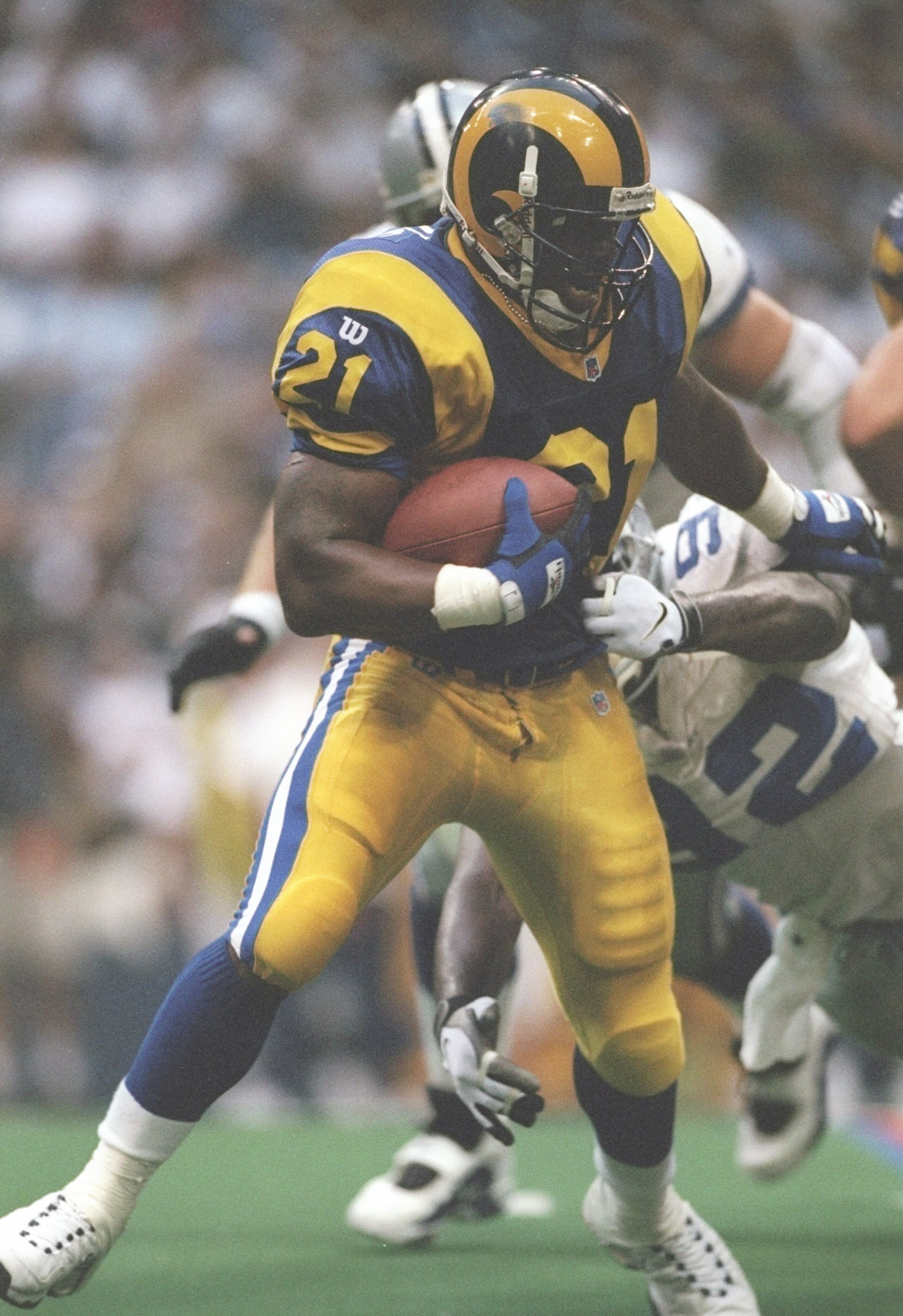 15 Aug 1997: Running back Lawrence Phillips of the St. Louis Rams runs down the field during a game against the Dallas Cowboys at Texas Stadium in Irving, Texas. The Cowboys won the game 34-31.