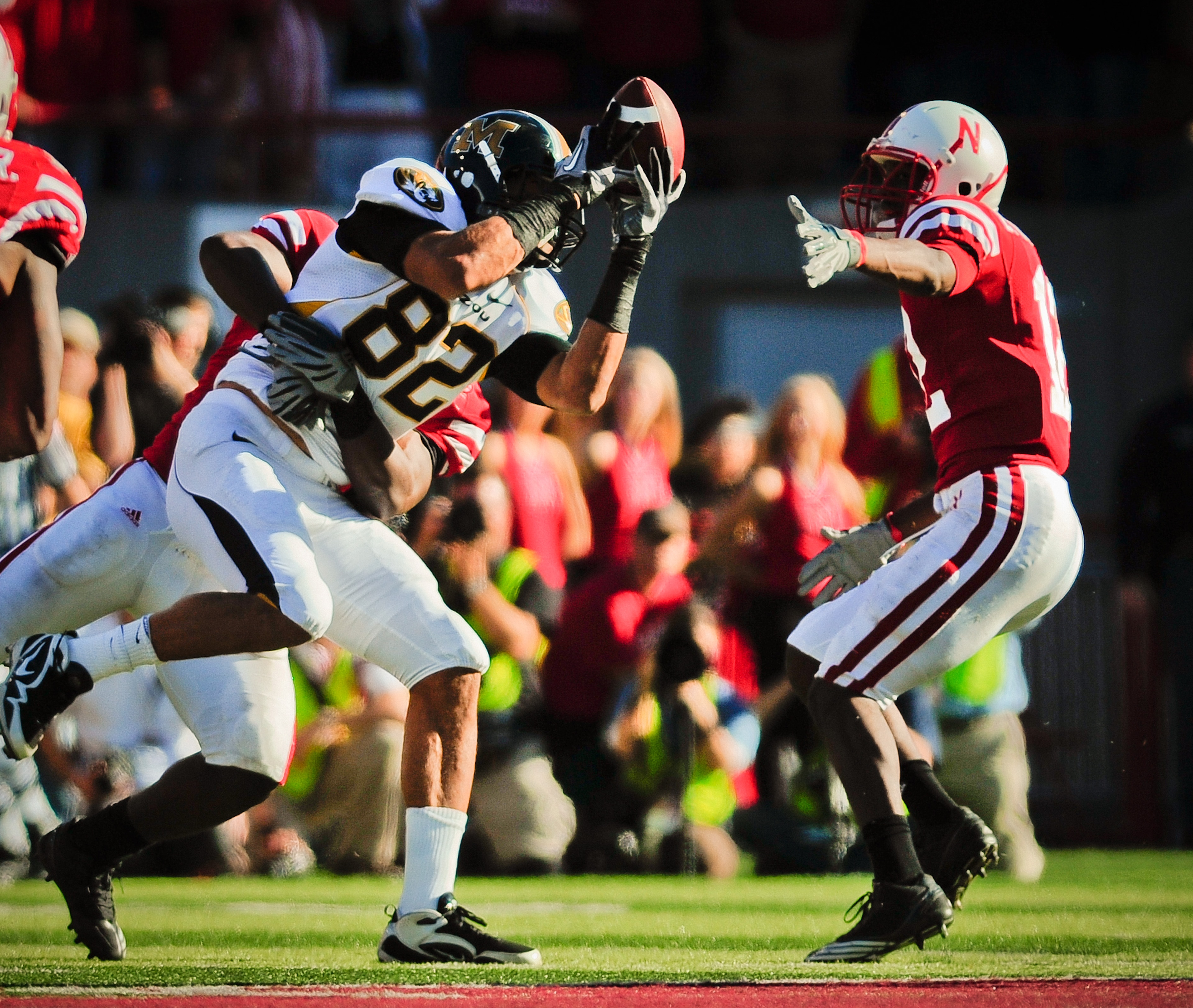 LINCOLN, NE - OCTOBER 30: Tight end Michael Egnew #82 of the Missouri Tigers attempts to haul in a pass in front of safety Courtney Osborne #12 of the Nebraska Cornhuskers during second half action of their game at Memorial Stadium on October 30, 2010 in
