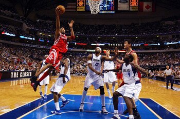DALLAS - MAY 2:  Tracy McGrady #1 of the Houston Rockets drives to the hoop against Josh Howard #5 of the Dallas Mavericks in Game five of the Western Conference Quarterfinals during the 2005 NBA Playoffs on May 2, 2005 at the American Airlines Center in 
