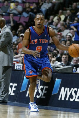 EAST RUTHERFORD, NJ - MARCH 26:  Latrell Sprewell #8 of the New York Knicks brings the bal upcourt during the NBA game against the New Jersey Nets at Continental Airlines Arena on March 26, 2003 in East Rutherford, New Jersey.  The Nets won 101-95.  NOTE