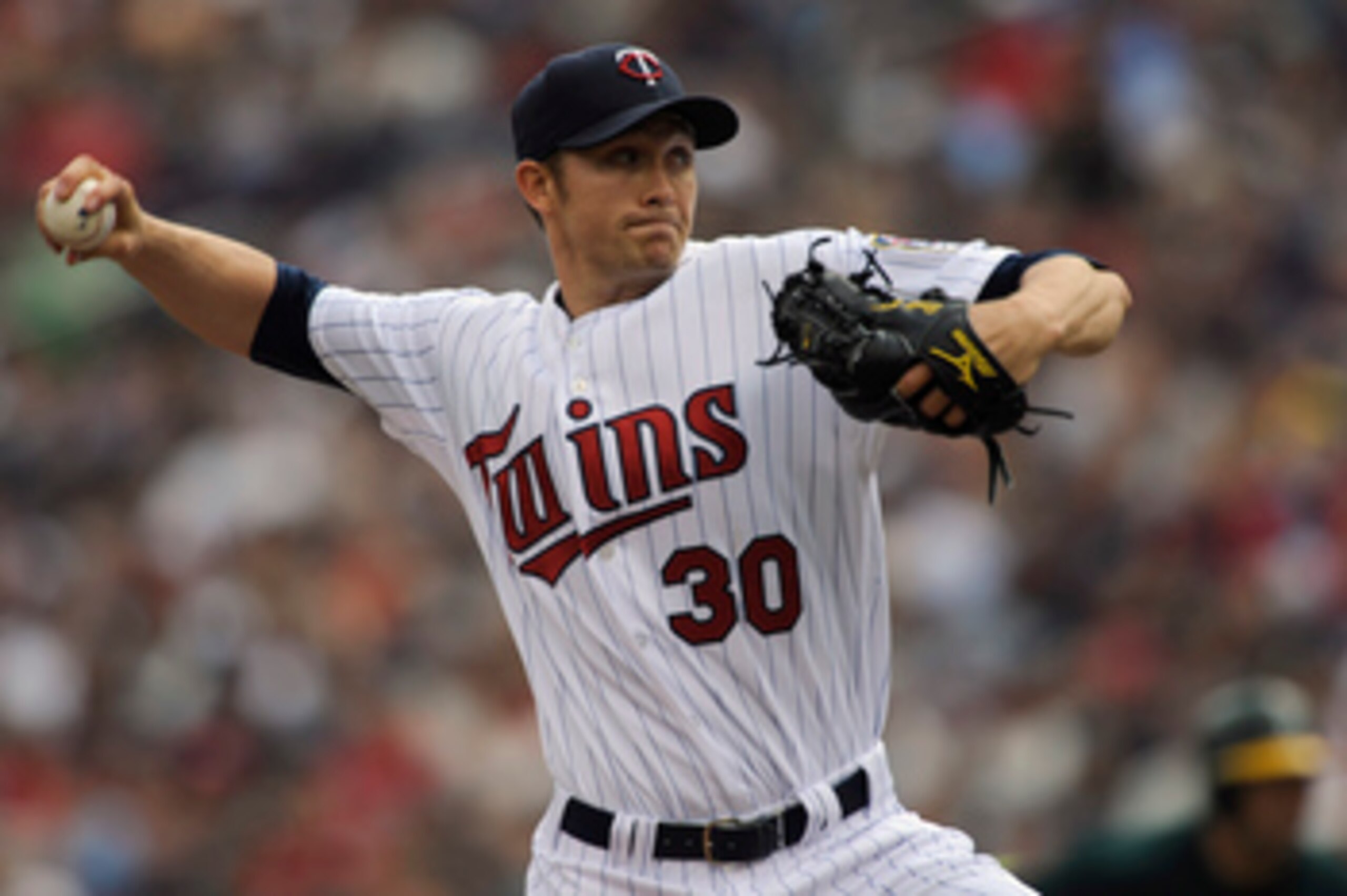 MINNEAPOLIS, MN - APRIL 10: Starting pitcher Scott Baker #30 of the Minnesota Twins throws against the Oakland Athletics during the first inning of a game on April 10, 2011 at Target Field in Minneapolis, Minnesota. (Photo by Hannah Foslien/Getty Images)