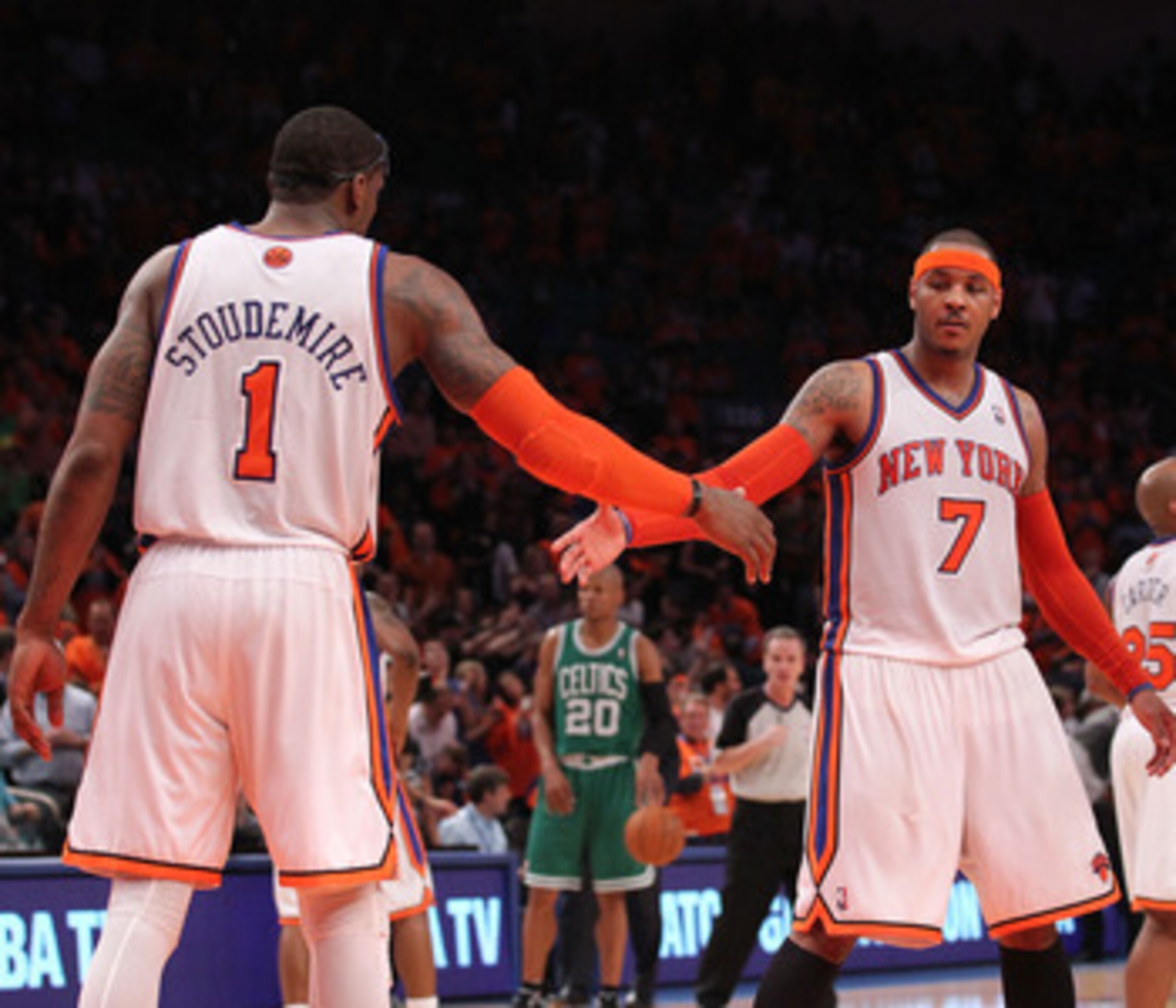 NEW YORK, NY - APRIL 24:  (L-R) Amar'e Stoudemire #1, Carmelo Anthony #7 and Shawne Williams #3 of the New York Knicks celebrate a play against the Boston Celtics in Game Four of the Eastern Conference Quarterfinals during the 2011 NBA Playoffs on April 2
